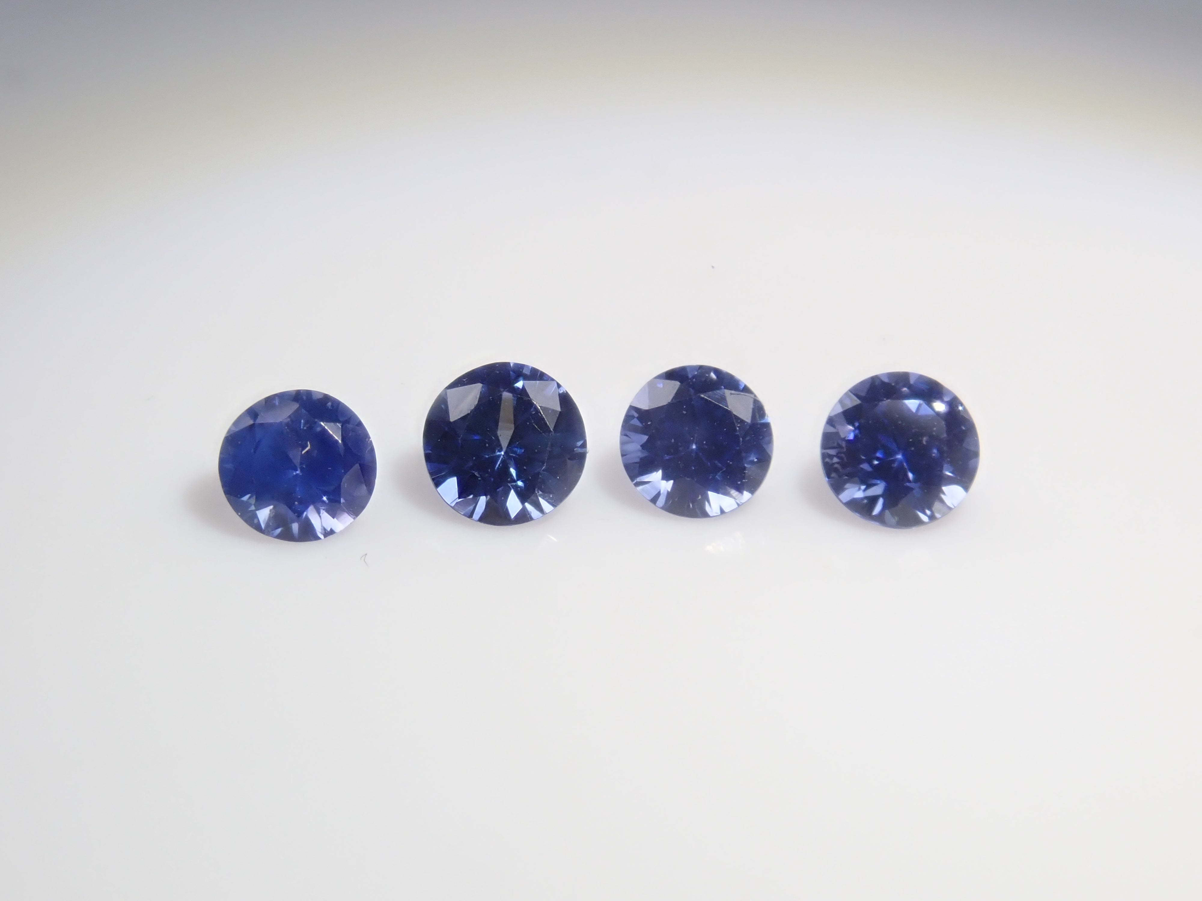 Limited to 4 sets: Sri Lankan sapphire (2.5mm, round cut) and Sri Lankan glass body set of 2 stones. Discounts available for multiple purchases.
