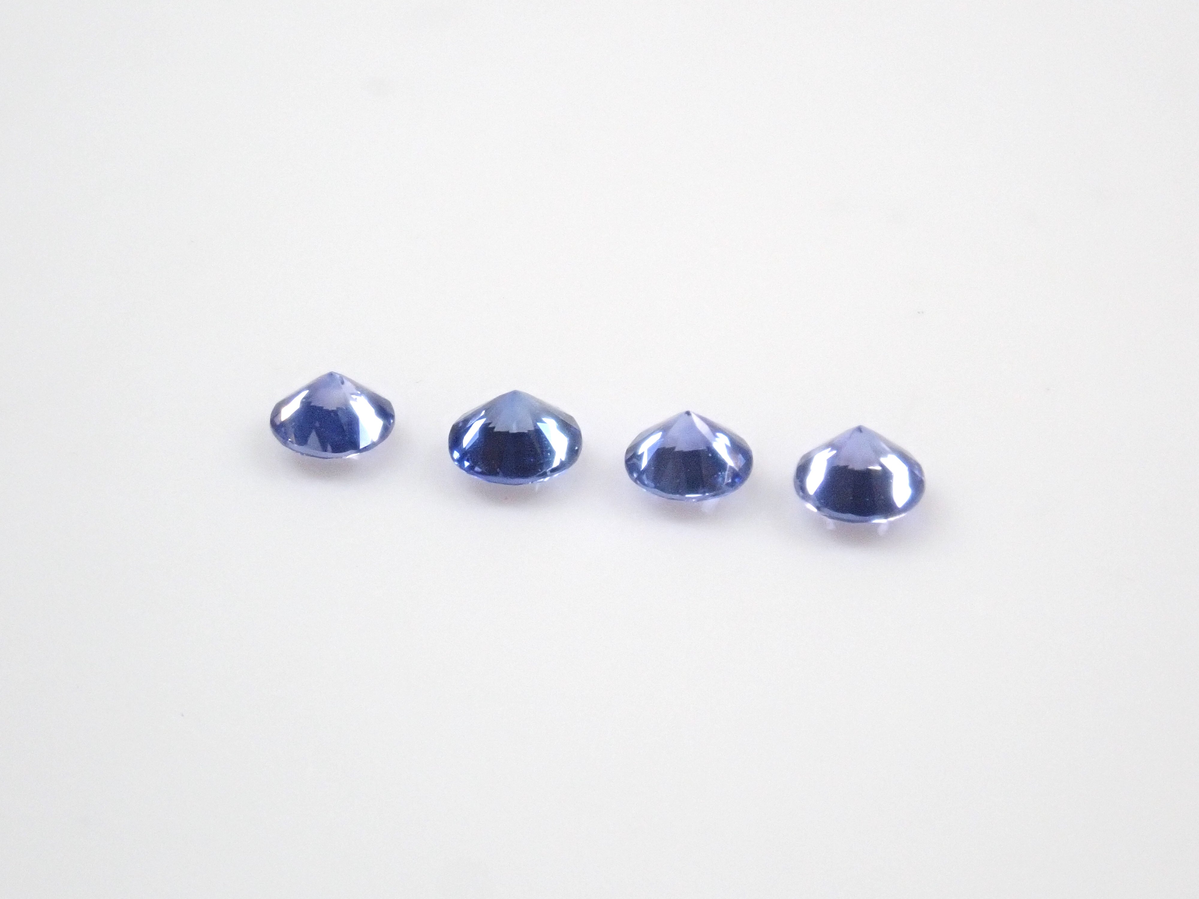 Limited to 4 sets: Sri Lankan sapphire (2.5mm, round cut) and Sri Lankan glass body set of 2 stones. Discounts available for multiple purchases.