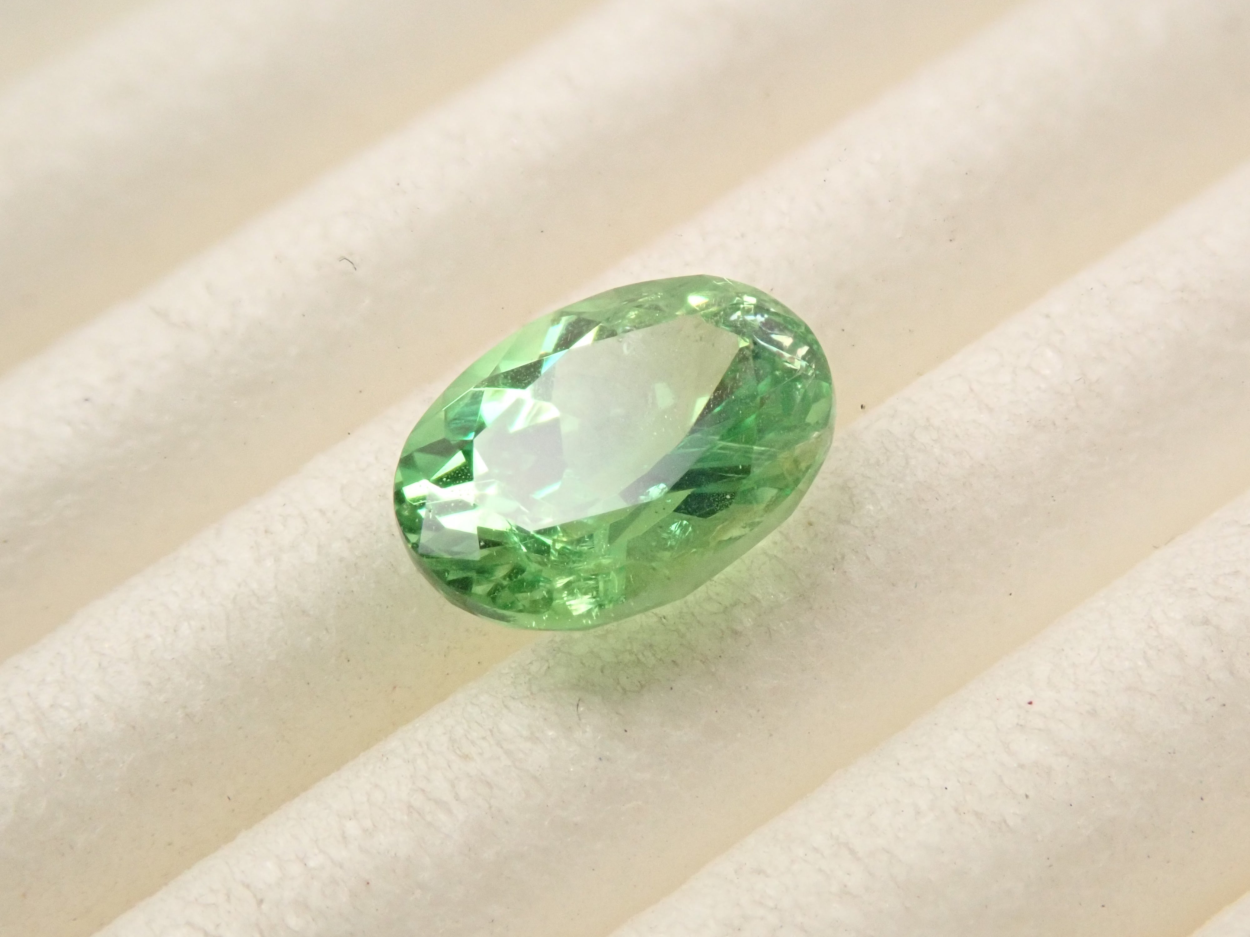 【12561607掲載】タンザニア産バイカラーグロッシュラーガーネット 0.796ctルース