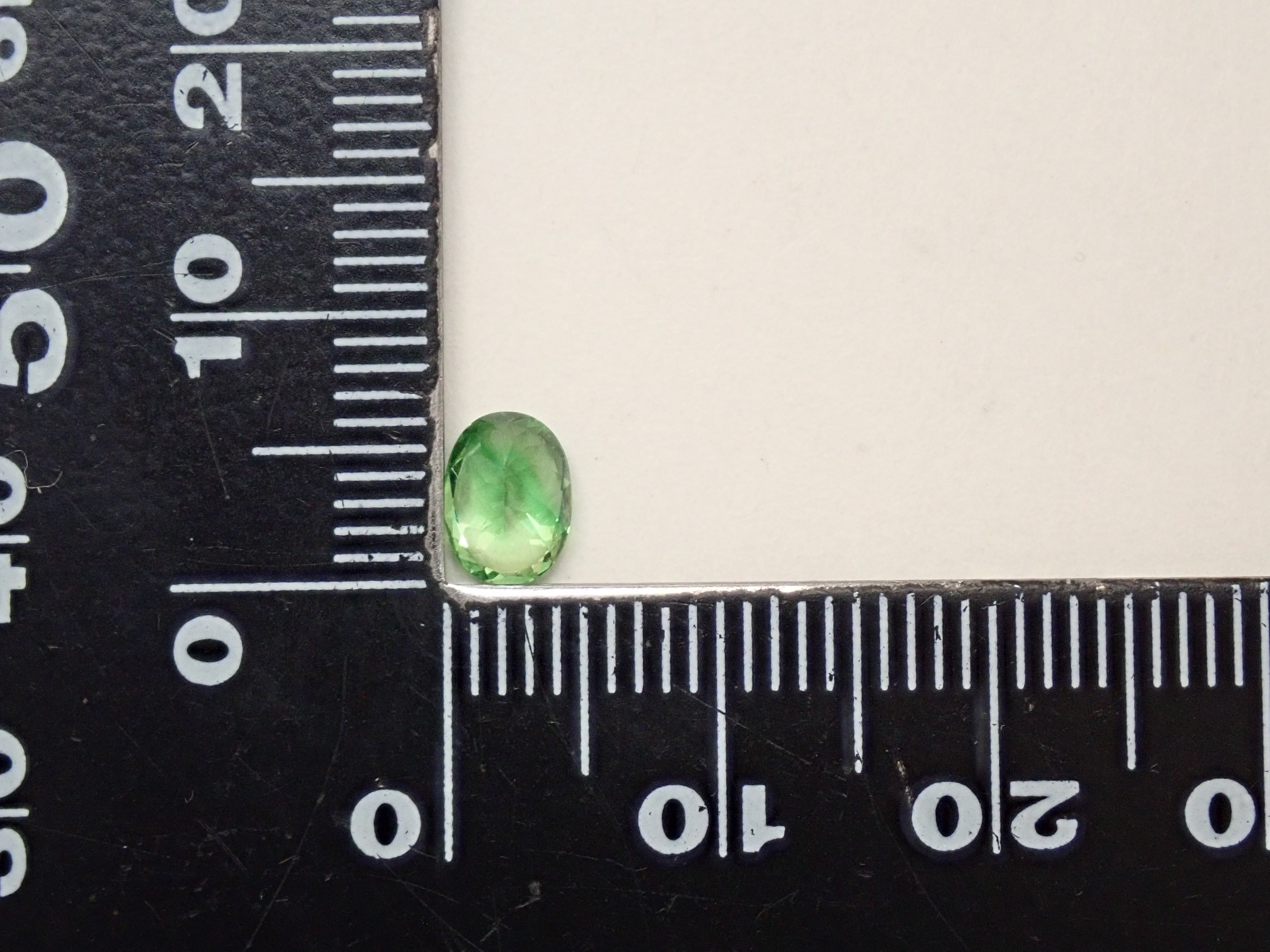 【12561607掲載】タンザニア産バイカラーグロッシュラーガーネット 0.796ctルース