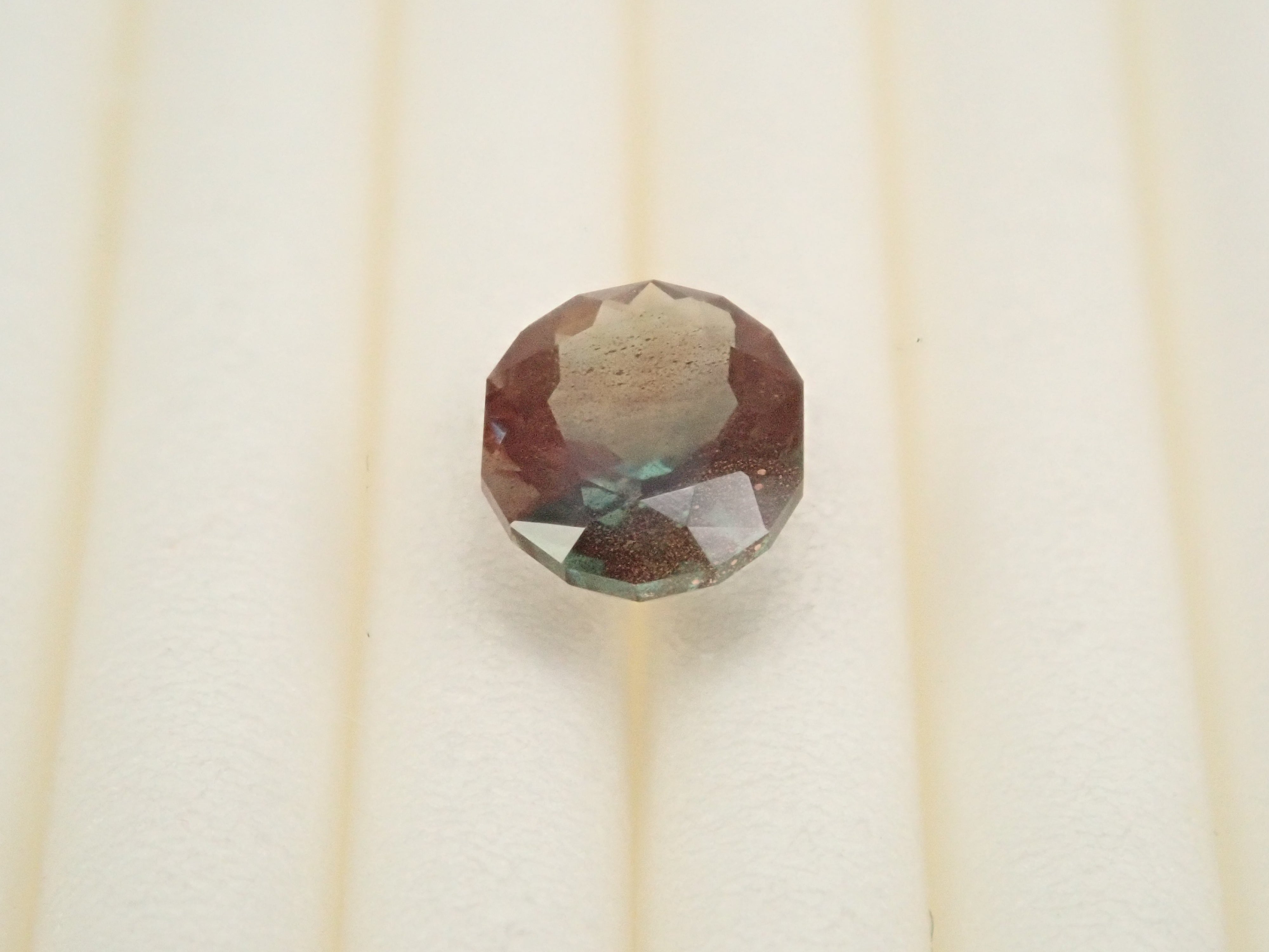 【12561305掲載】アメリカ産オレゴンサンストーン 0.472ctルース