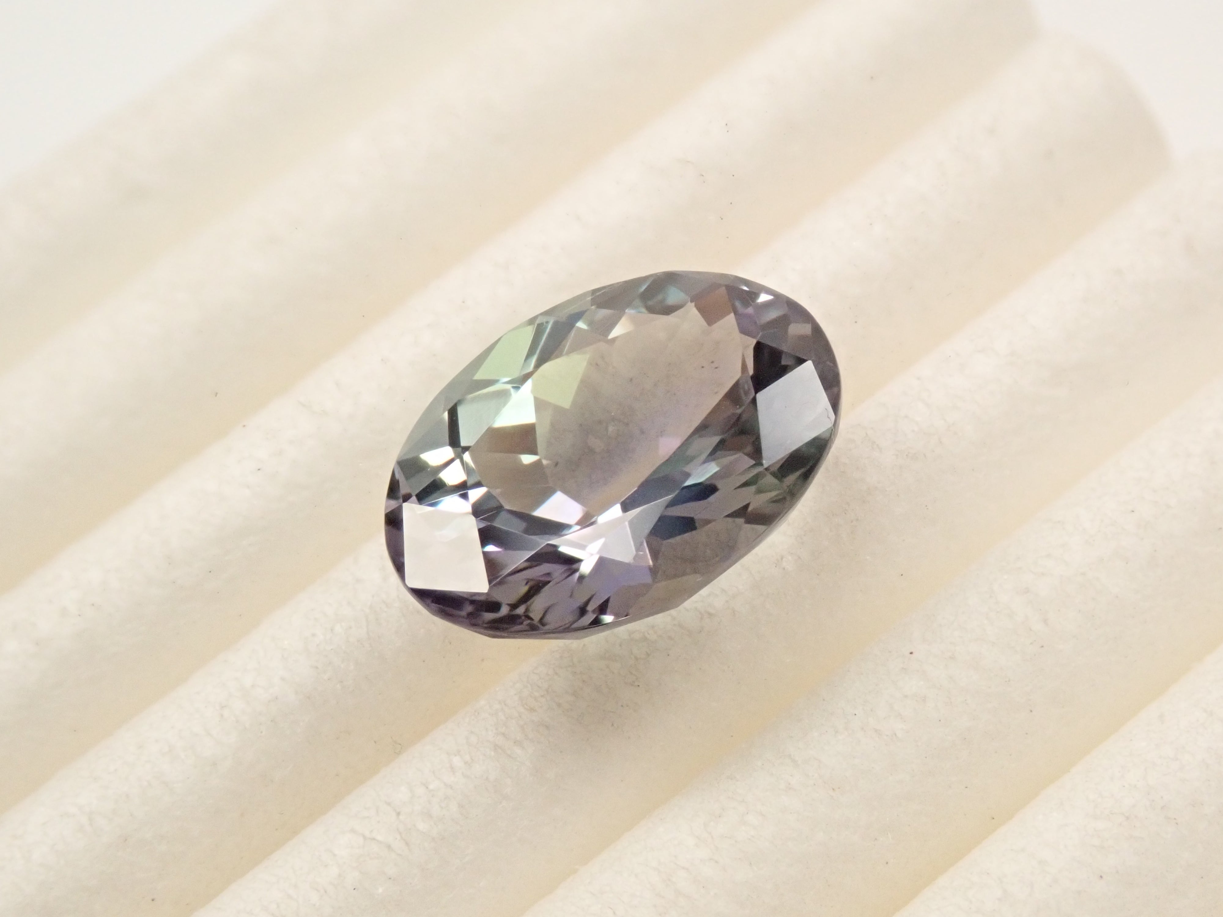 【12561550掲載】タンザニア産バイカラーゾイサイト 2.322ctルース