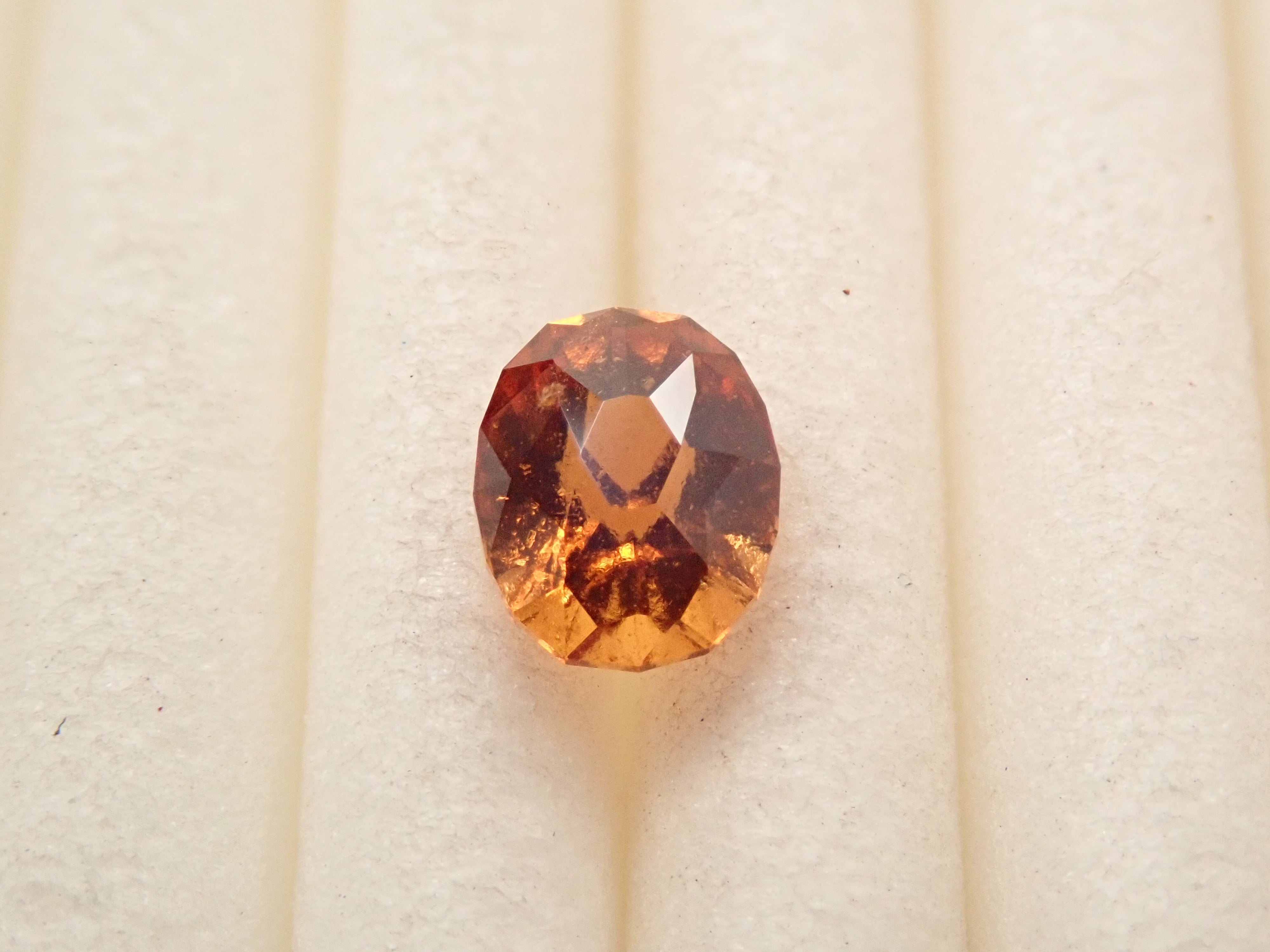 【12561612掲載】スリランカ産ヘソナイトガーネット 0.441ctルース