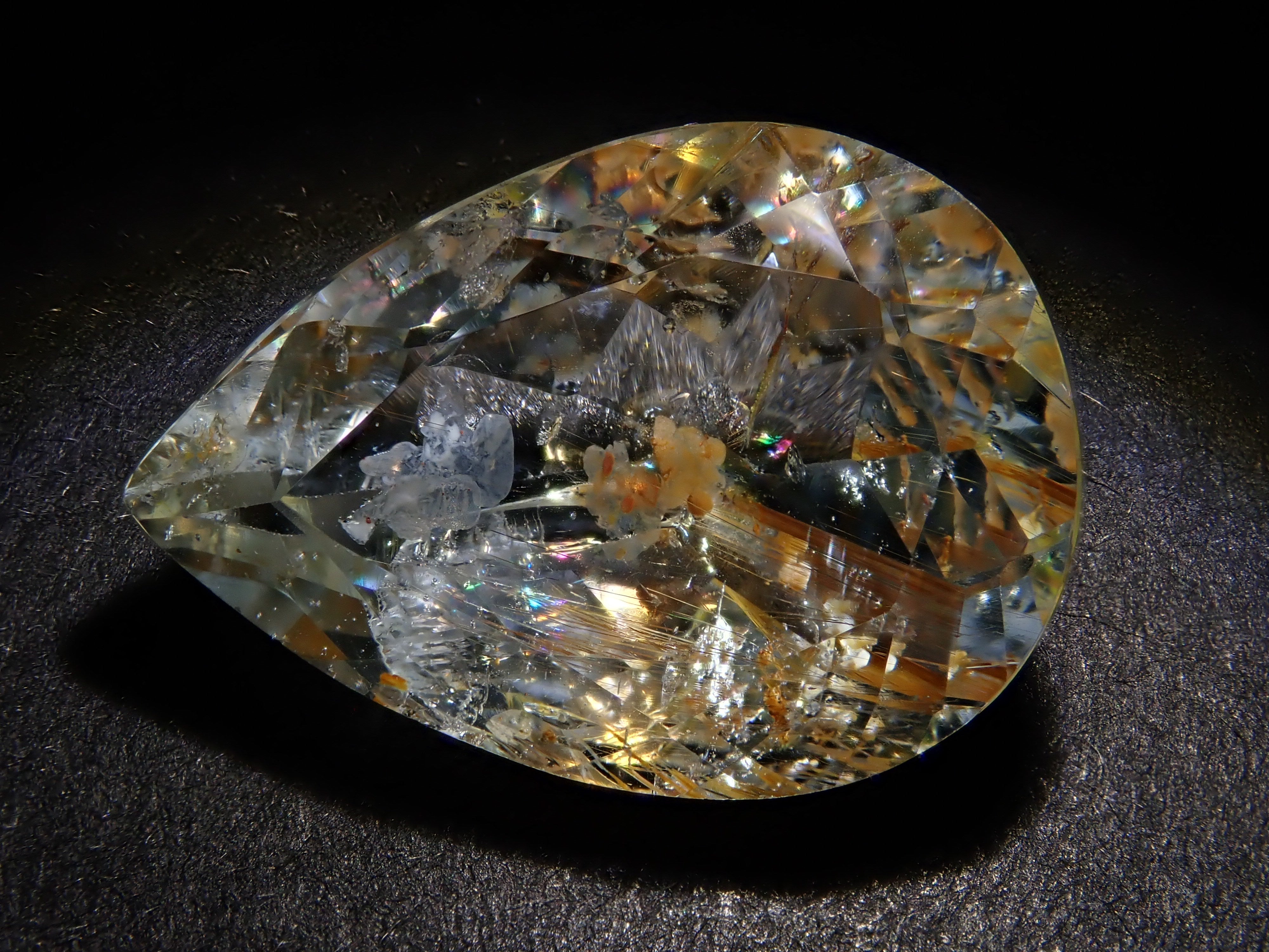 【12562024掲載】ブラジル産ライモナイトインブルートパーズ 9.314ctルース