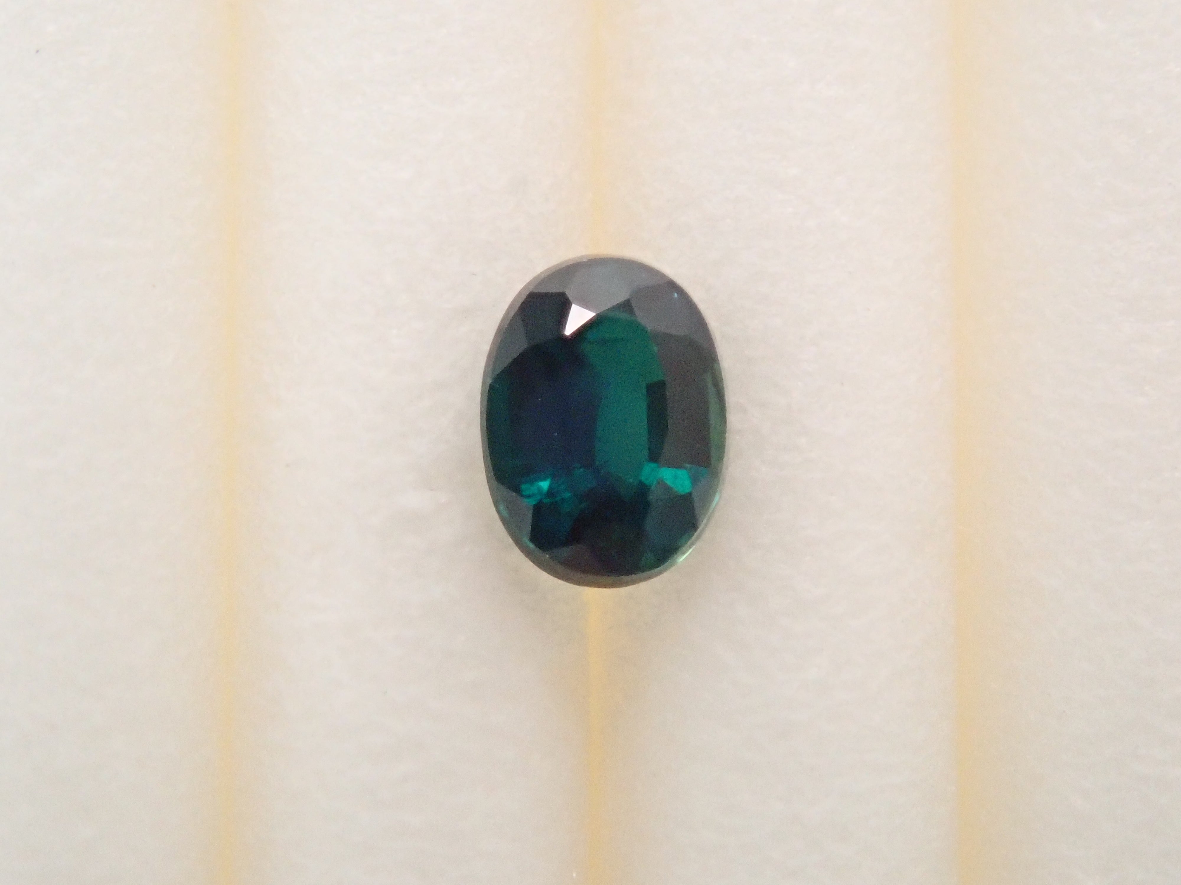 【12562656掲載】マダガスカル産グランディディエライト 0.132ctルース