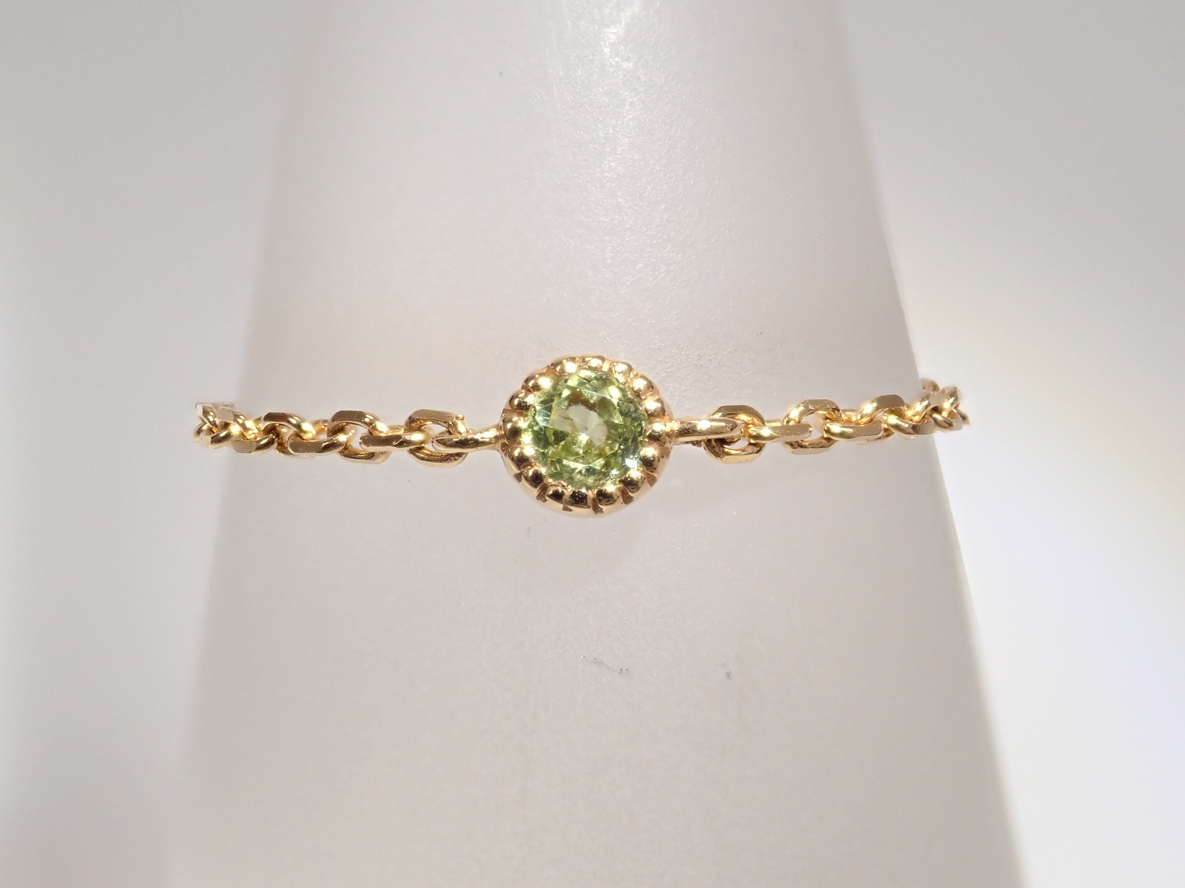 【22602566掲載】K18 ペリドット リング