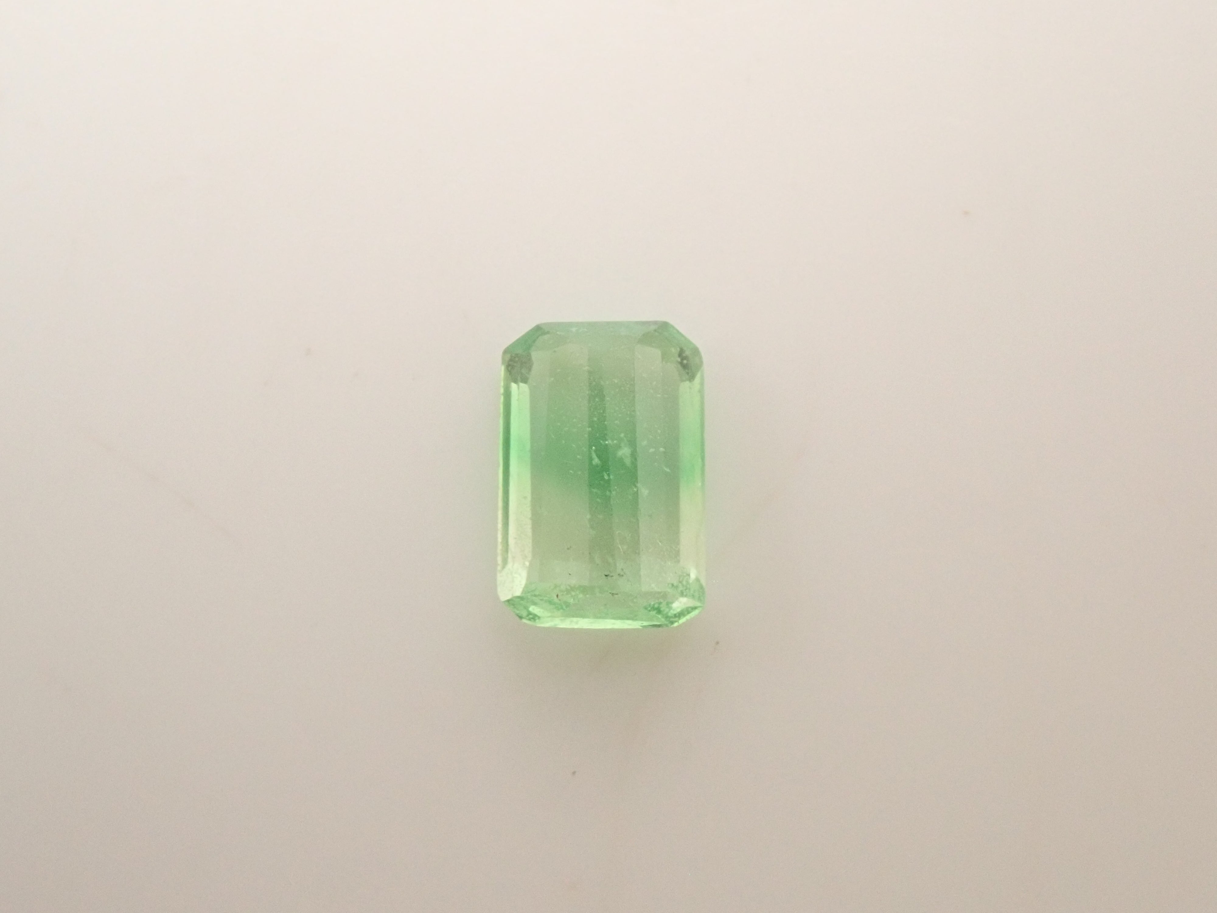 【12563461掲載】タンザニア産バイカラーグロッシュラーガーネット 0.602ctルース