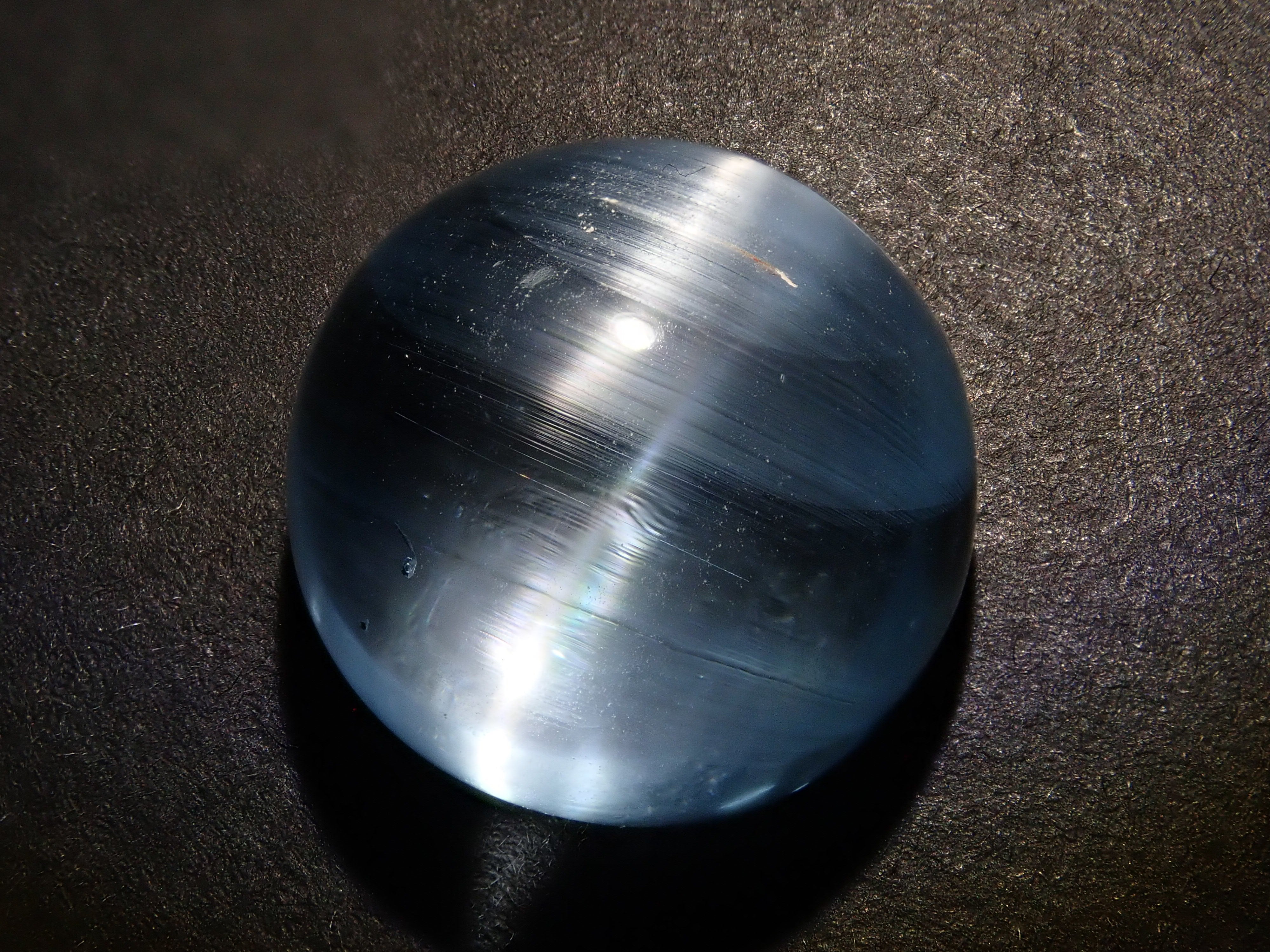 【12560374掲載】ブルートパーズキャッツアイ 22.761ctルース