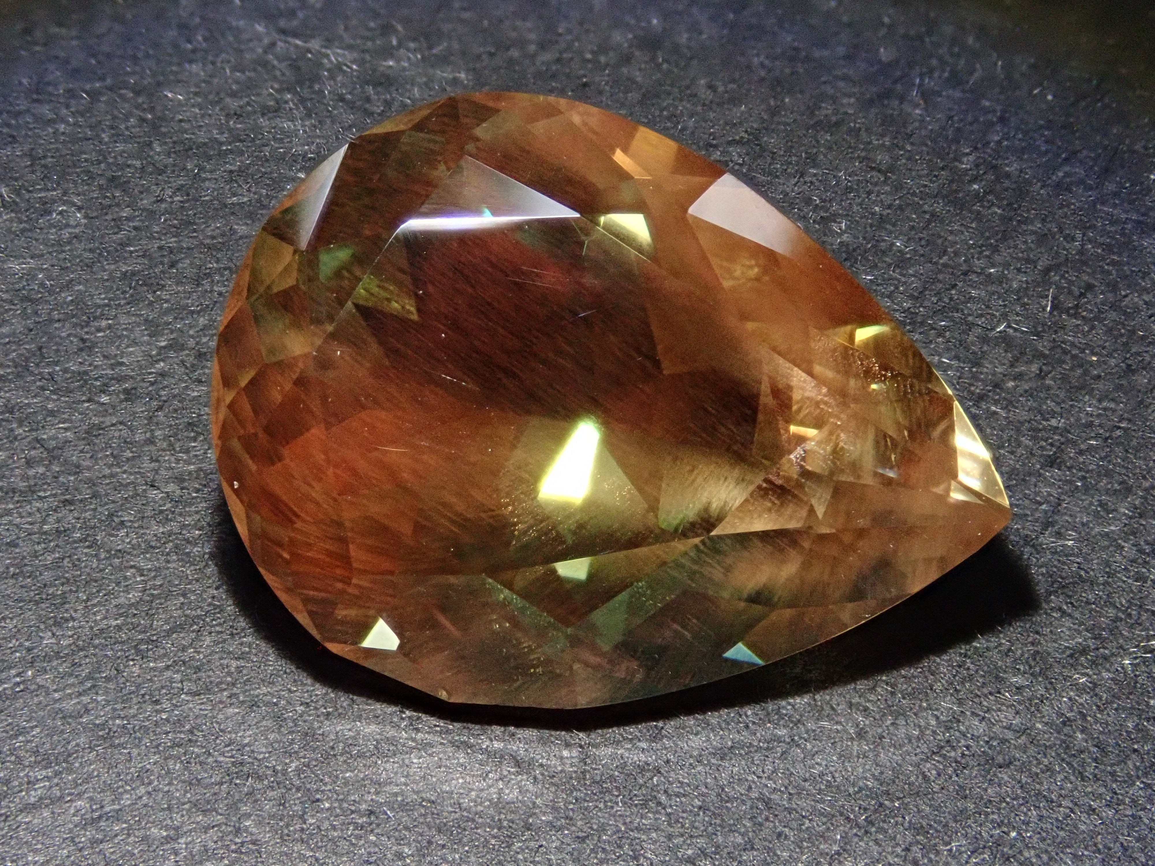 【12560346掲載】アメリカ産オレゴンサンストーン 8.338ctルース