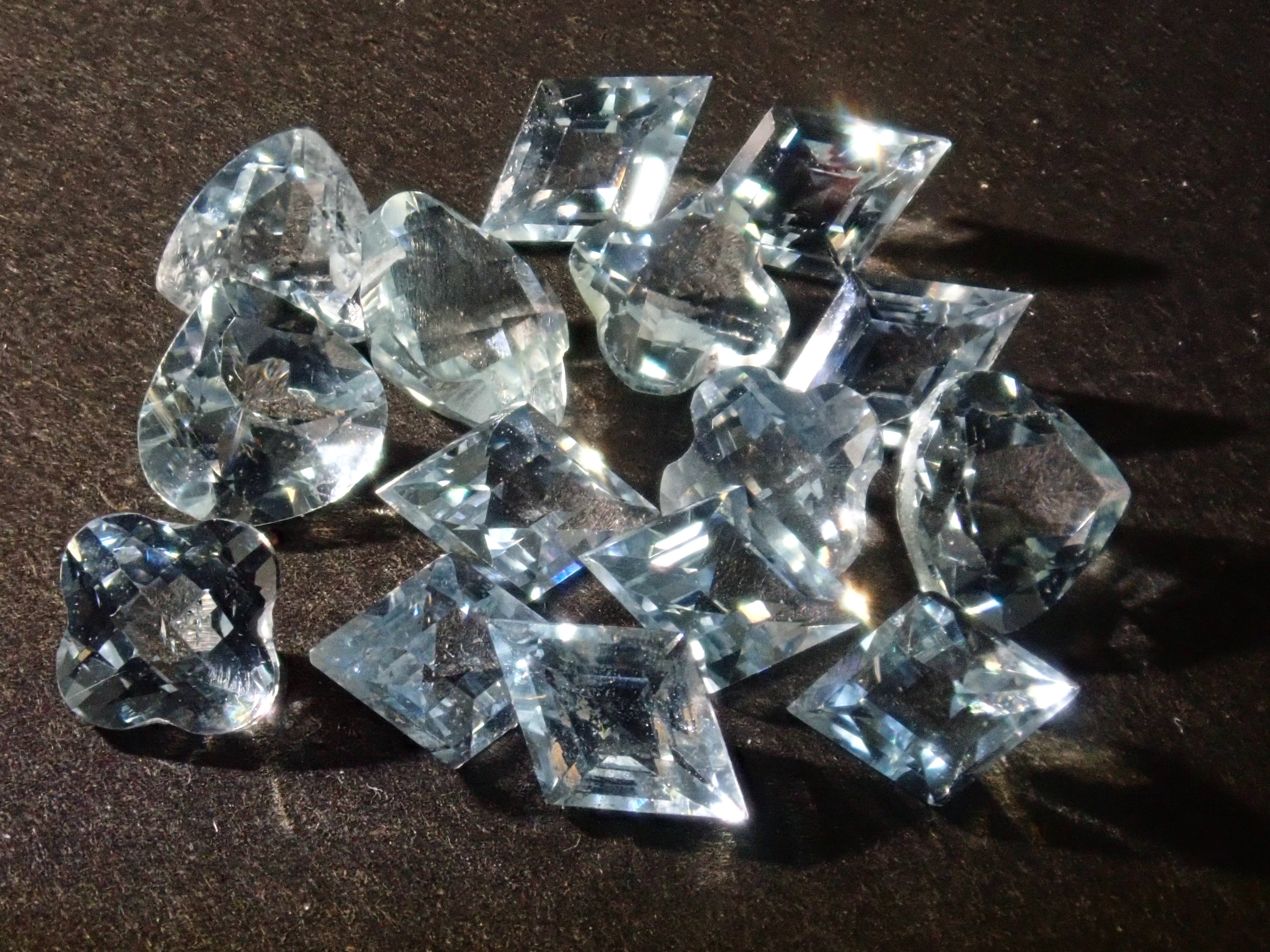 Limited to 15 stones: Mozambique aquamarine rough + 2 loose stones set. Discounts available for multiple purchases.