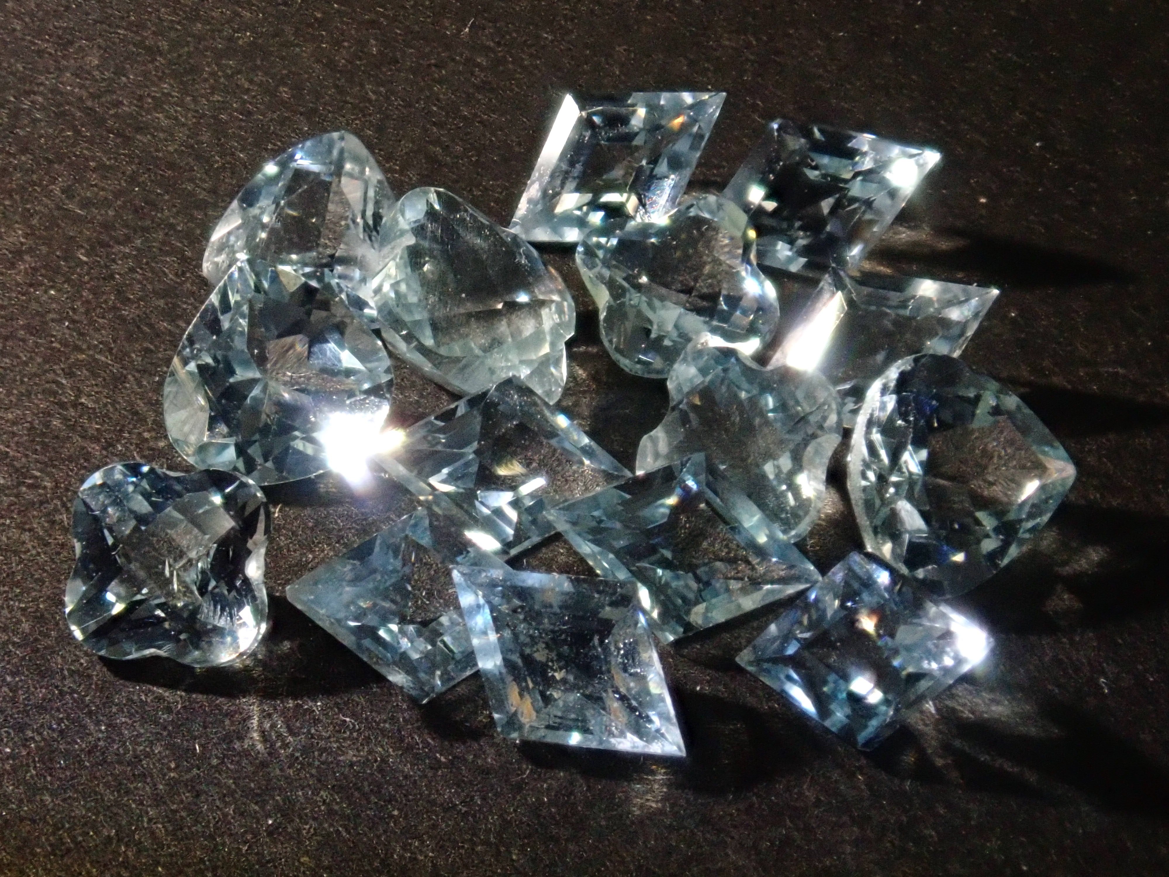 Limited to 15 stones: Mozambique aquamarine rough + 2 loose stones set. Discounts available for multiple purchases.