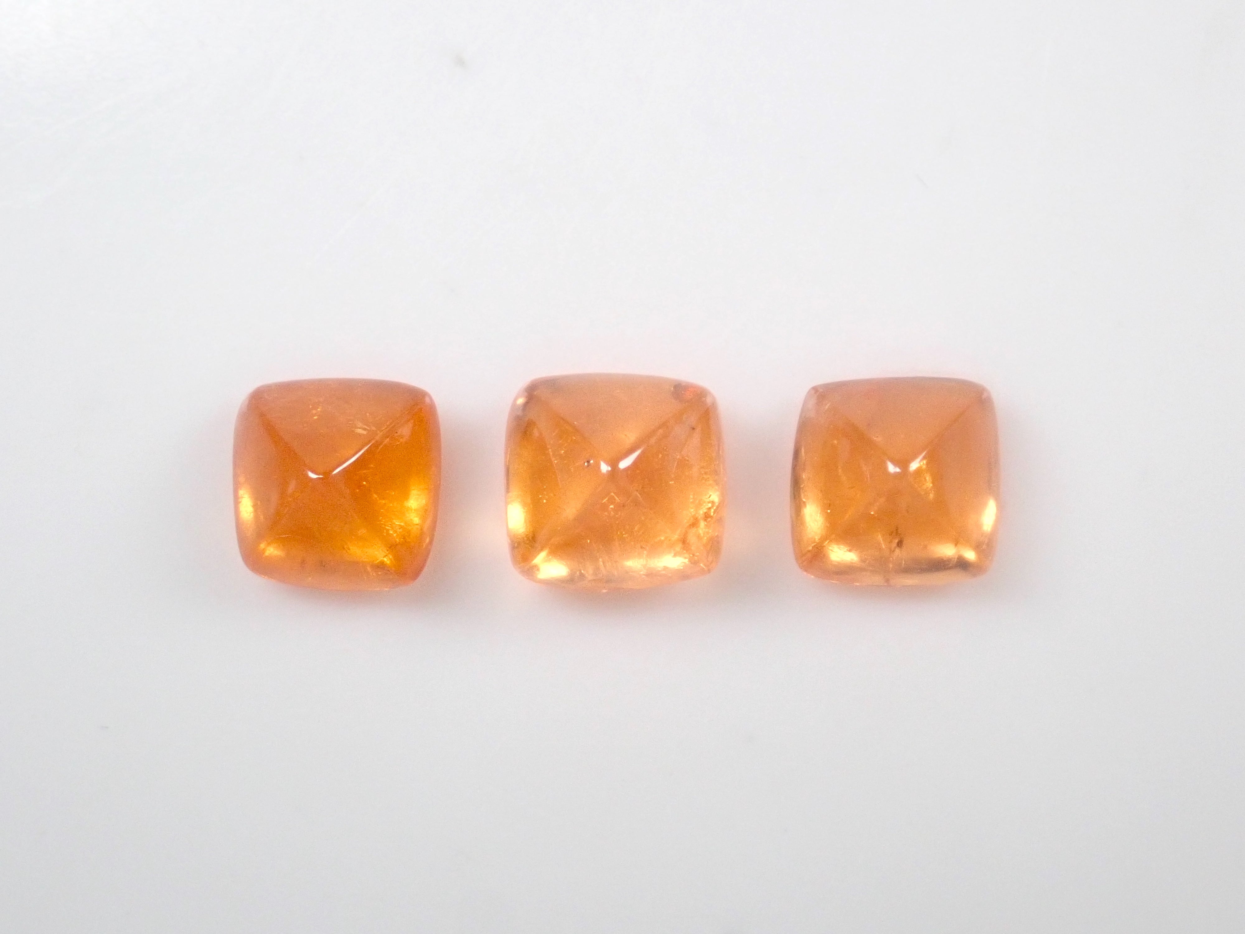 Limited to 3 stones: Tanzanian mandarin garnet (sugarloaf cut) 1 loose stone (multiple purchase discounts available)