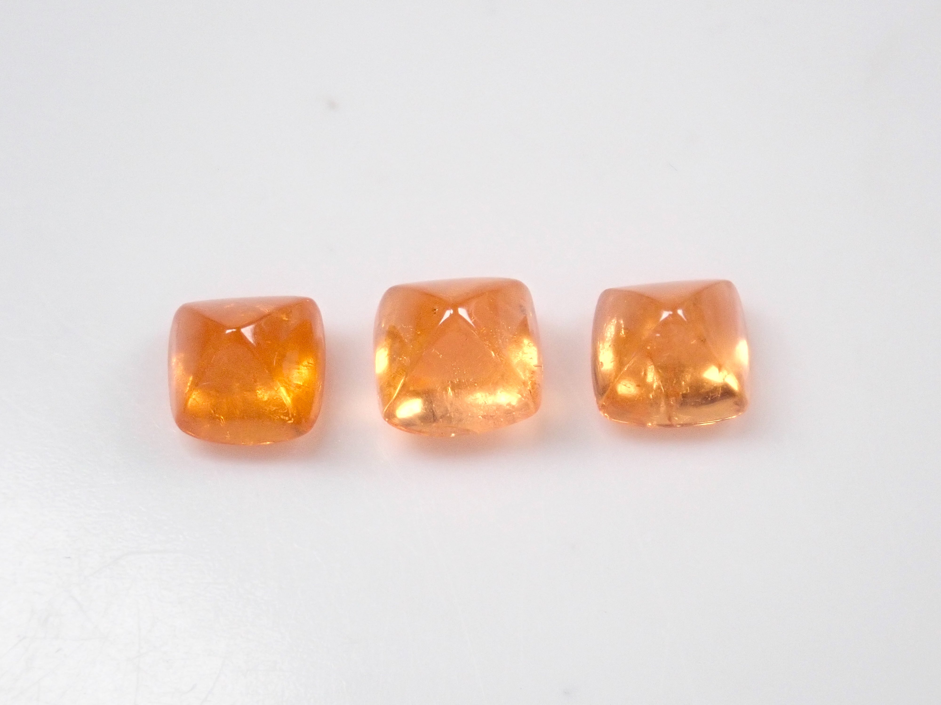 Limited to 3 stones: Tanzanian mandarin garnet (sugarloaf cut) 1 loose stone (multiple purchase discounts available)