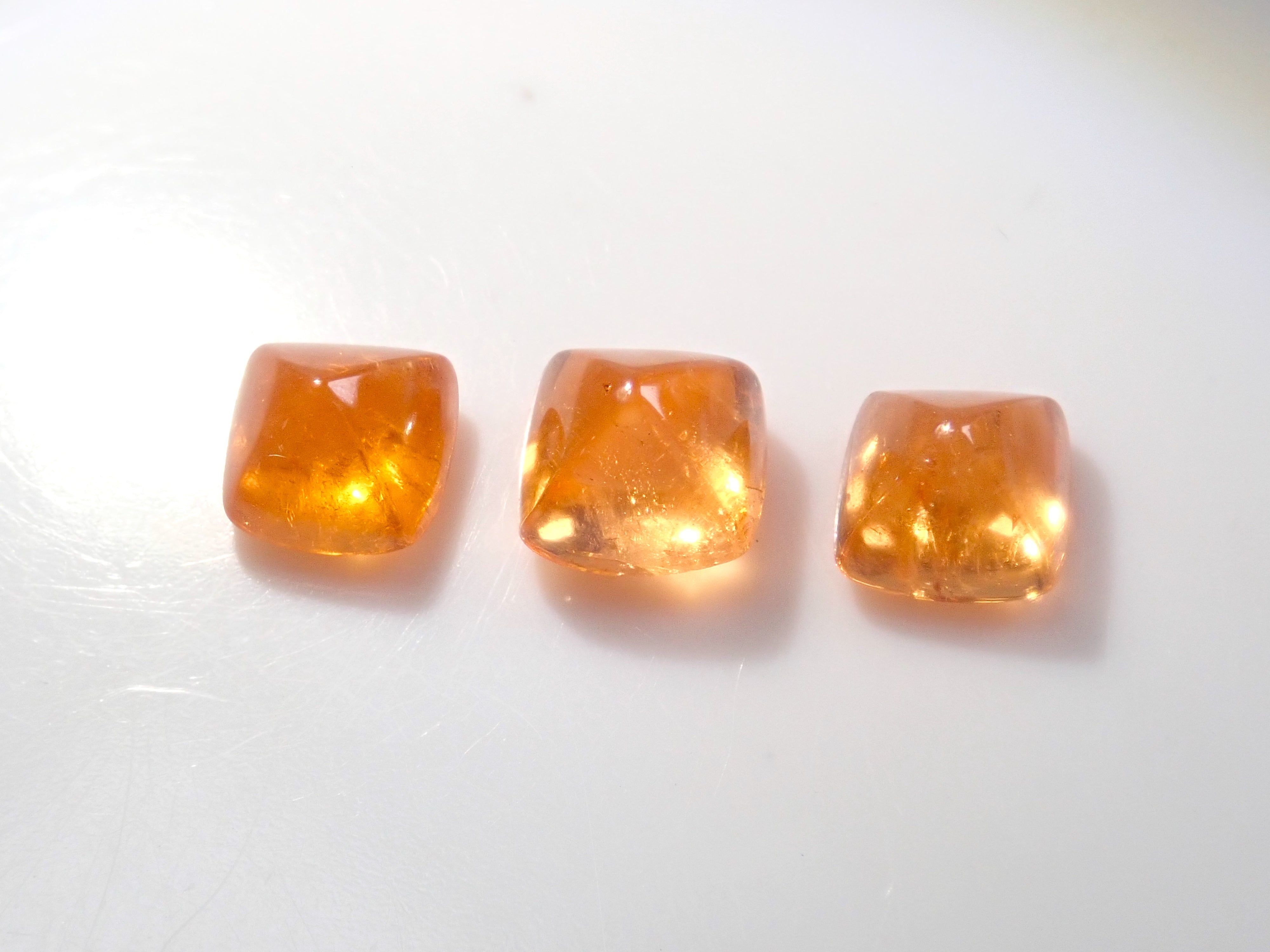 Limited to 3 stones: Tanzanian mandarin garnet (sugarloaf cut) 1 loose stone (multiple purchase discounts available)