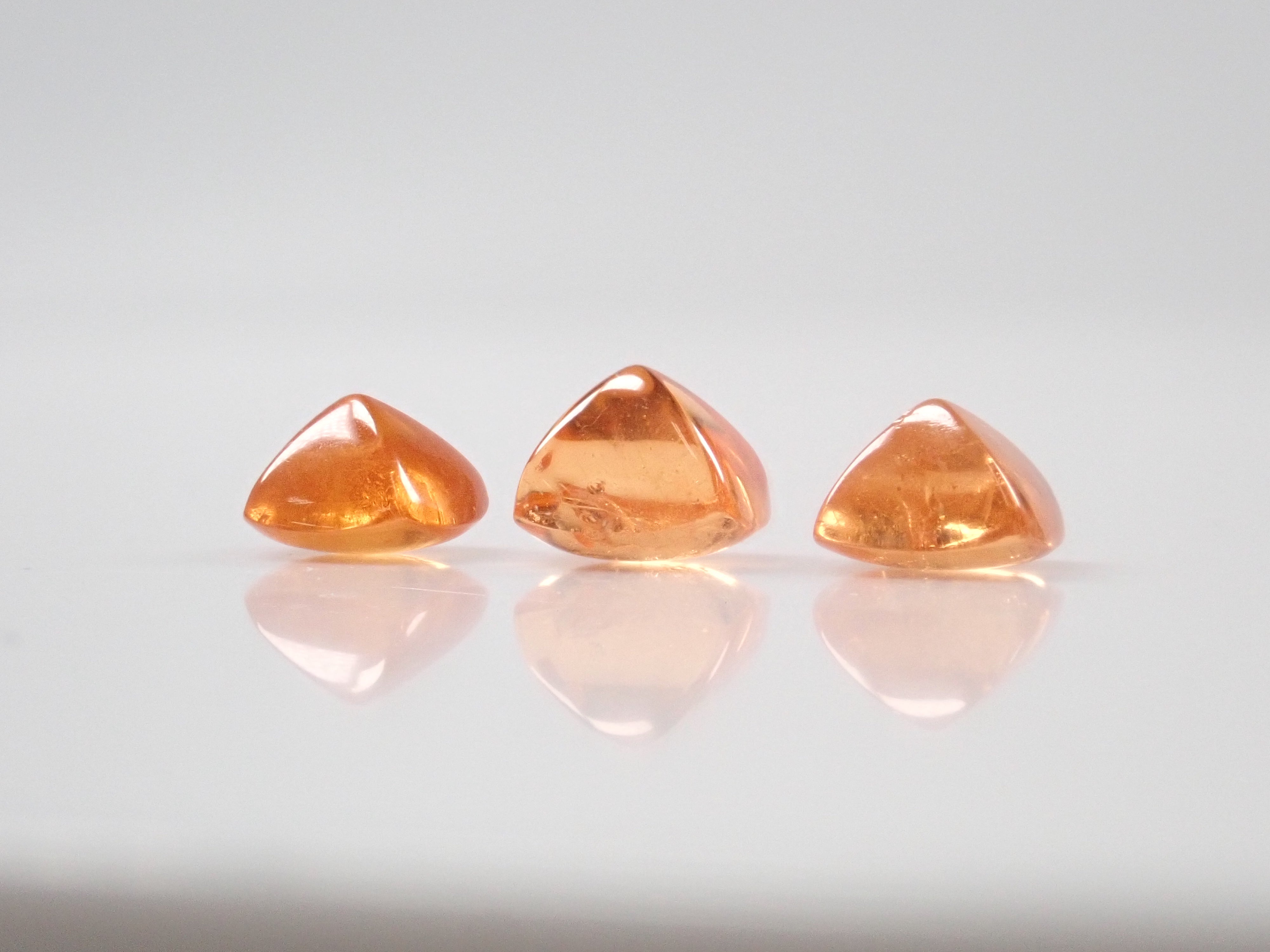 Limited to 3 stones: Tanzanian mandarin garnet (sugarloaf cut) 1 loose stone (multiple purchase discounts available)