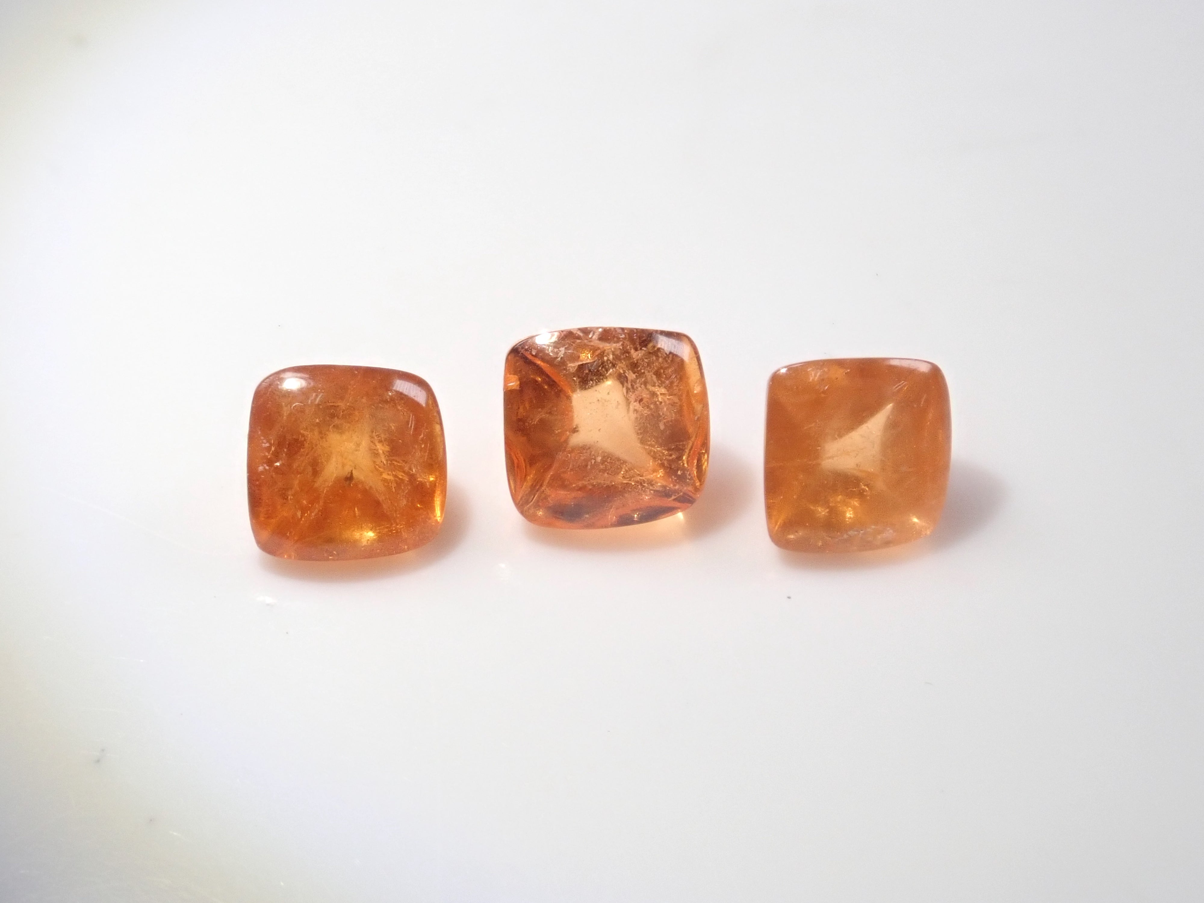 Limited to 3 stones: Tanzanian mandarin garnet (sugarloaf cut) 1 loose stone (multiple purchase discounts available)