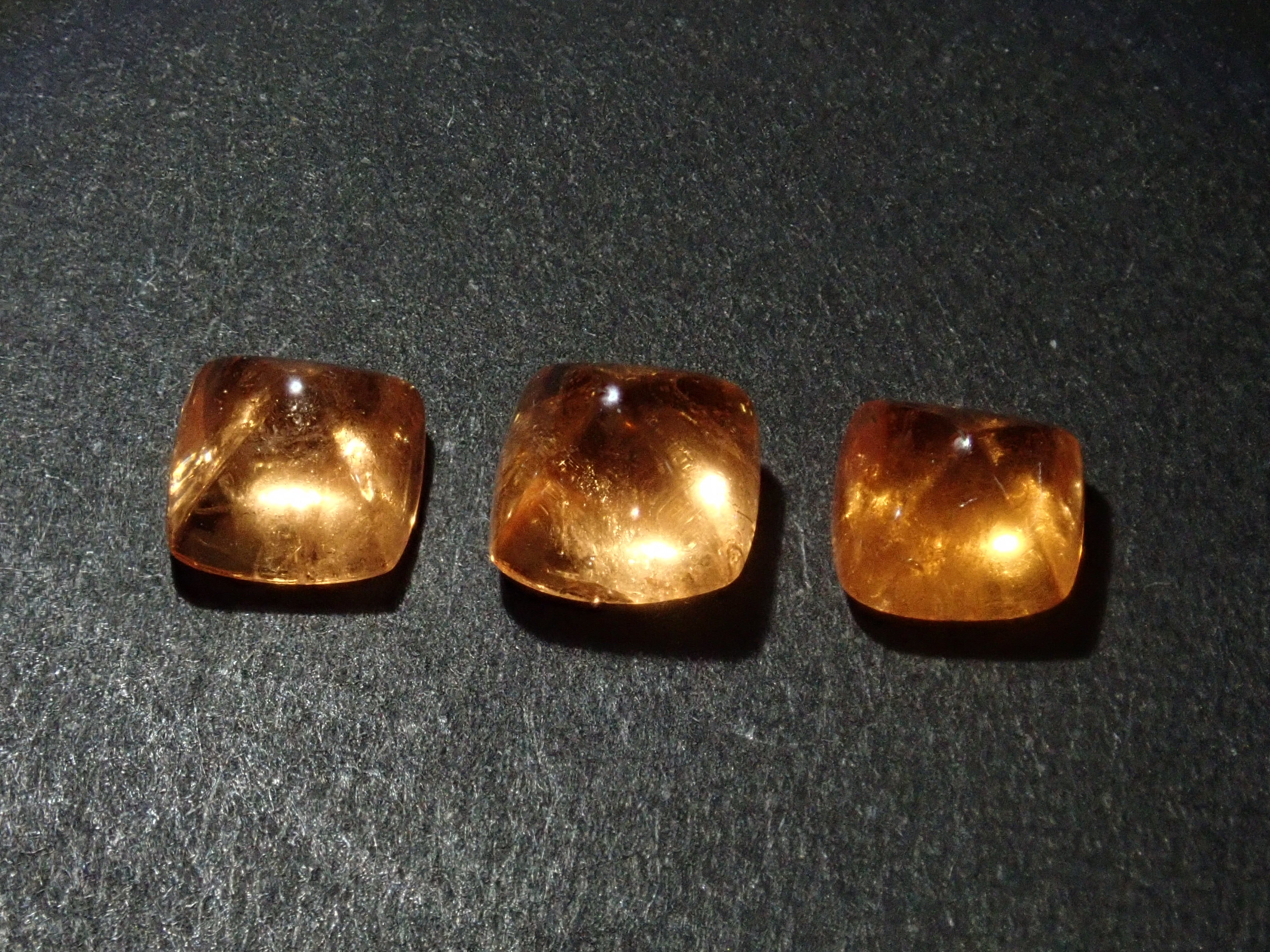 Limited to 3 stones: Tanzanian mandarin garnet (sugarloaf cut) 1 loose stone (multiple purchase discounts available)