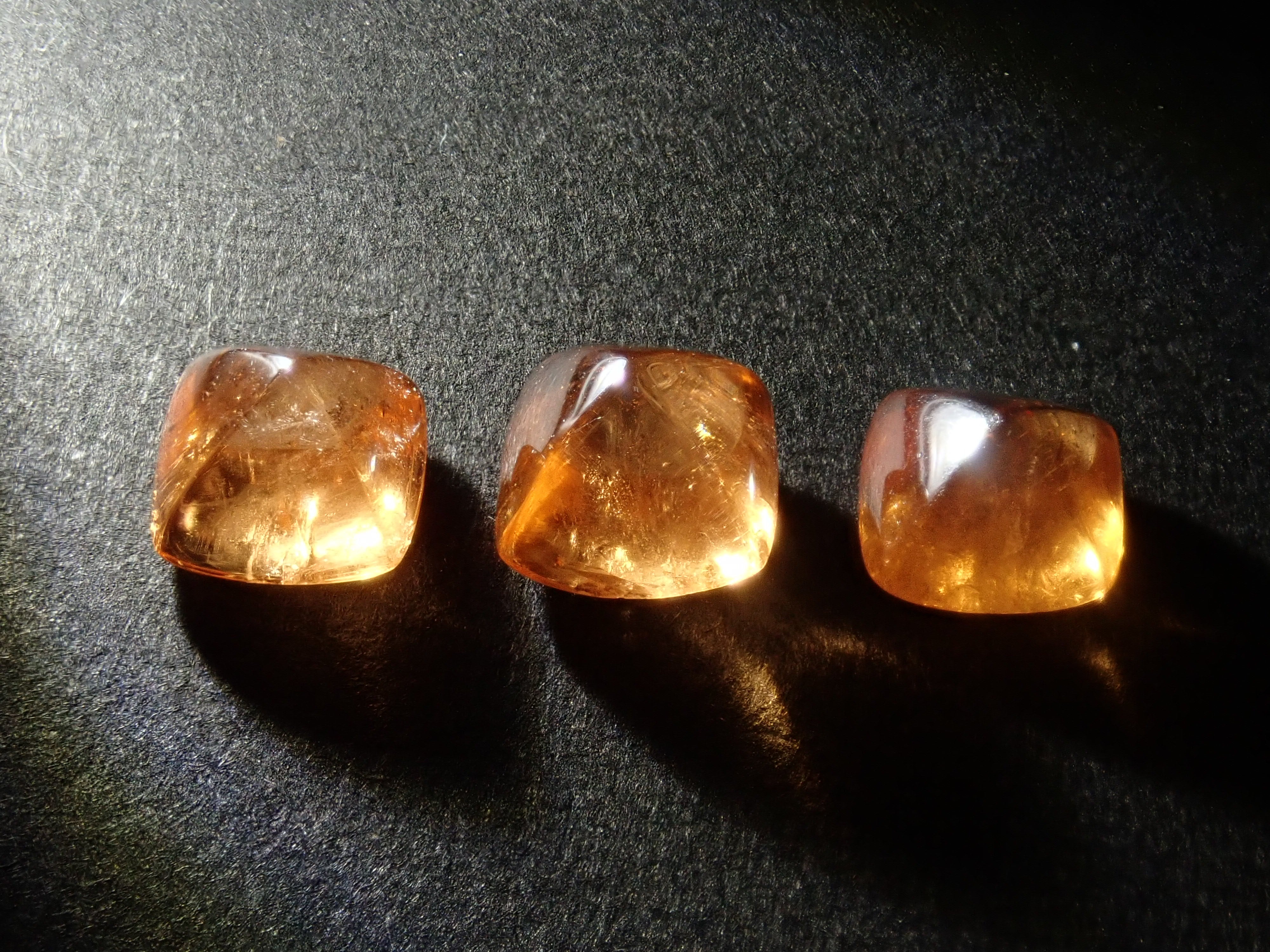 Limited to 3 stones: Tanzanian mandarin garnet (sugarloaf cut) 1 loose stone (multiple purchase discounts available)