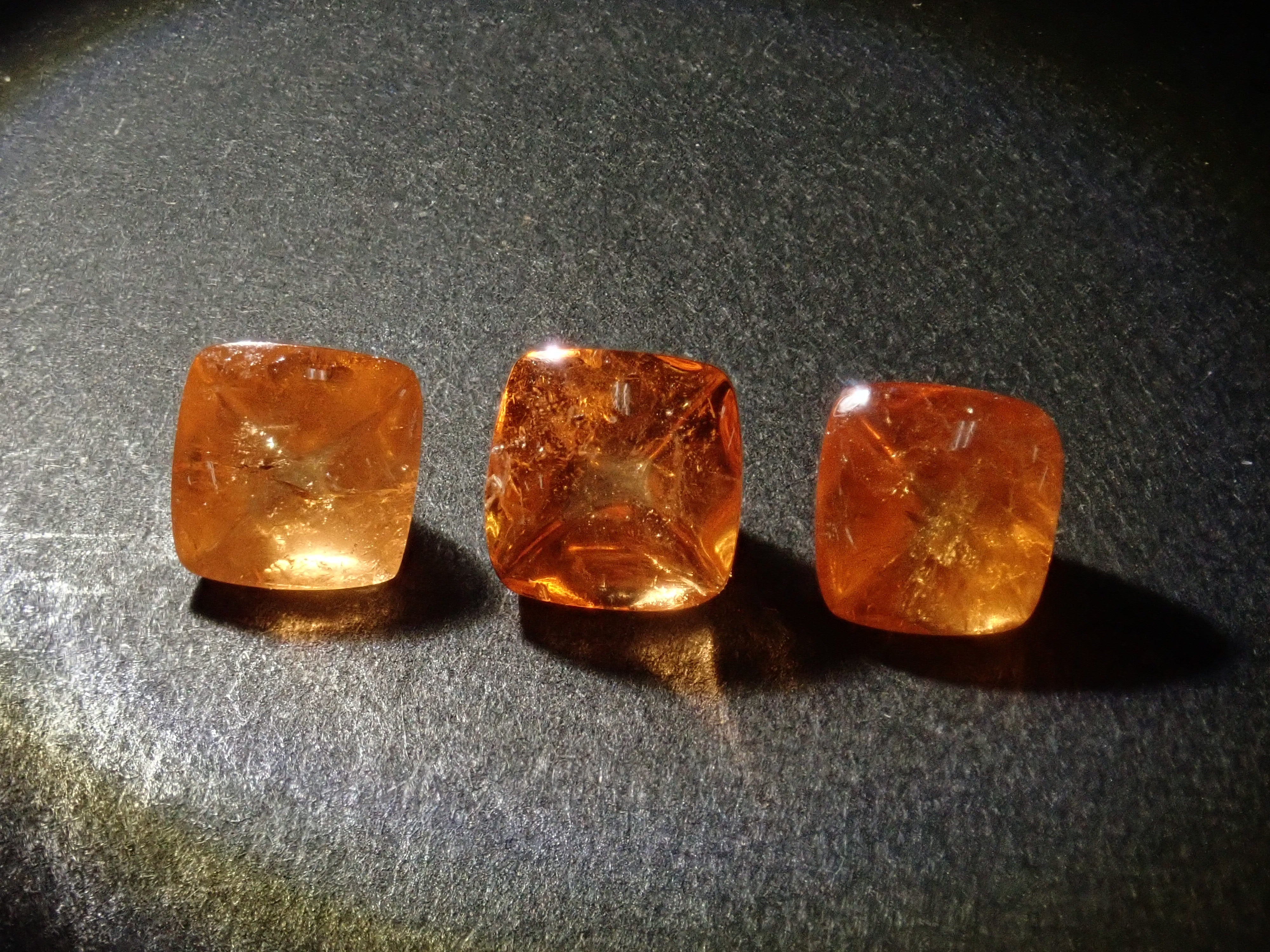 Limited to 3 stones: Tanzanian mandarin garnet (sugarloaf cut) 1 loose stone (multiple purchase discounts available)