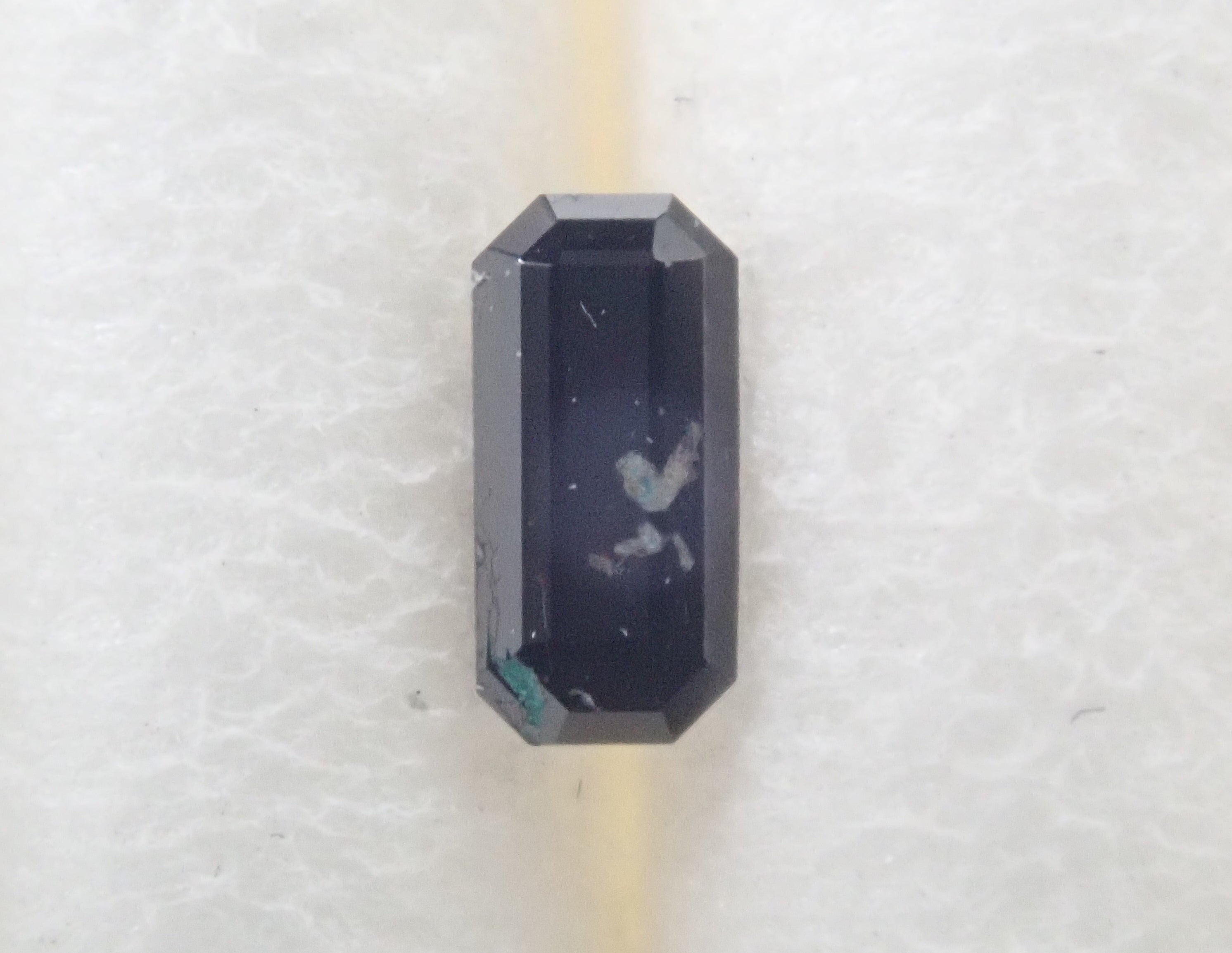 [12555515] American Neptunite 0.040ct loose stone