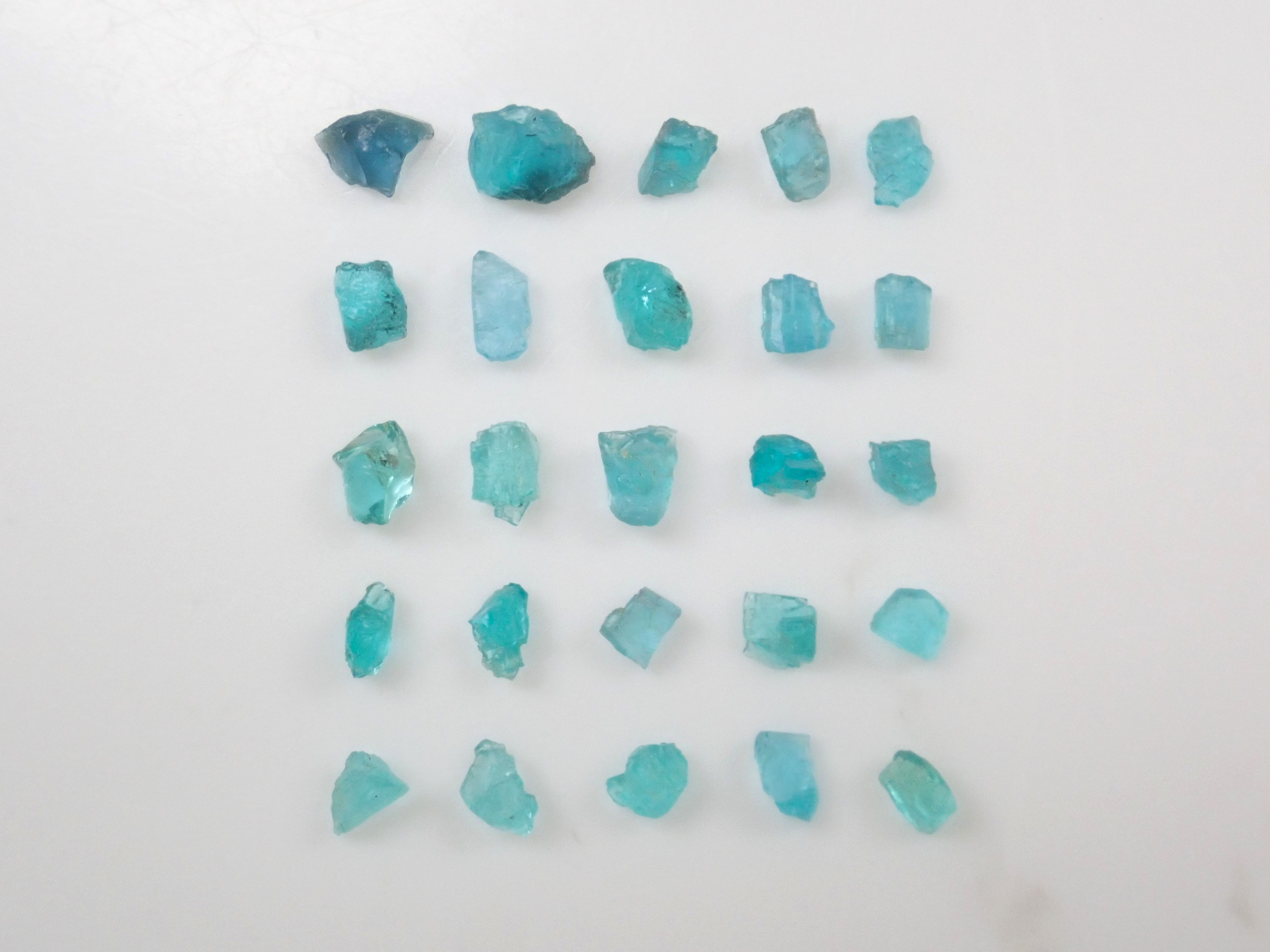 Limited to 25 stones: Brazilian Paraiba Tourmaline (including bicolor, Batalha) rough stones, average size 0.1ct. Discounts for multiple purchases available.