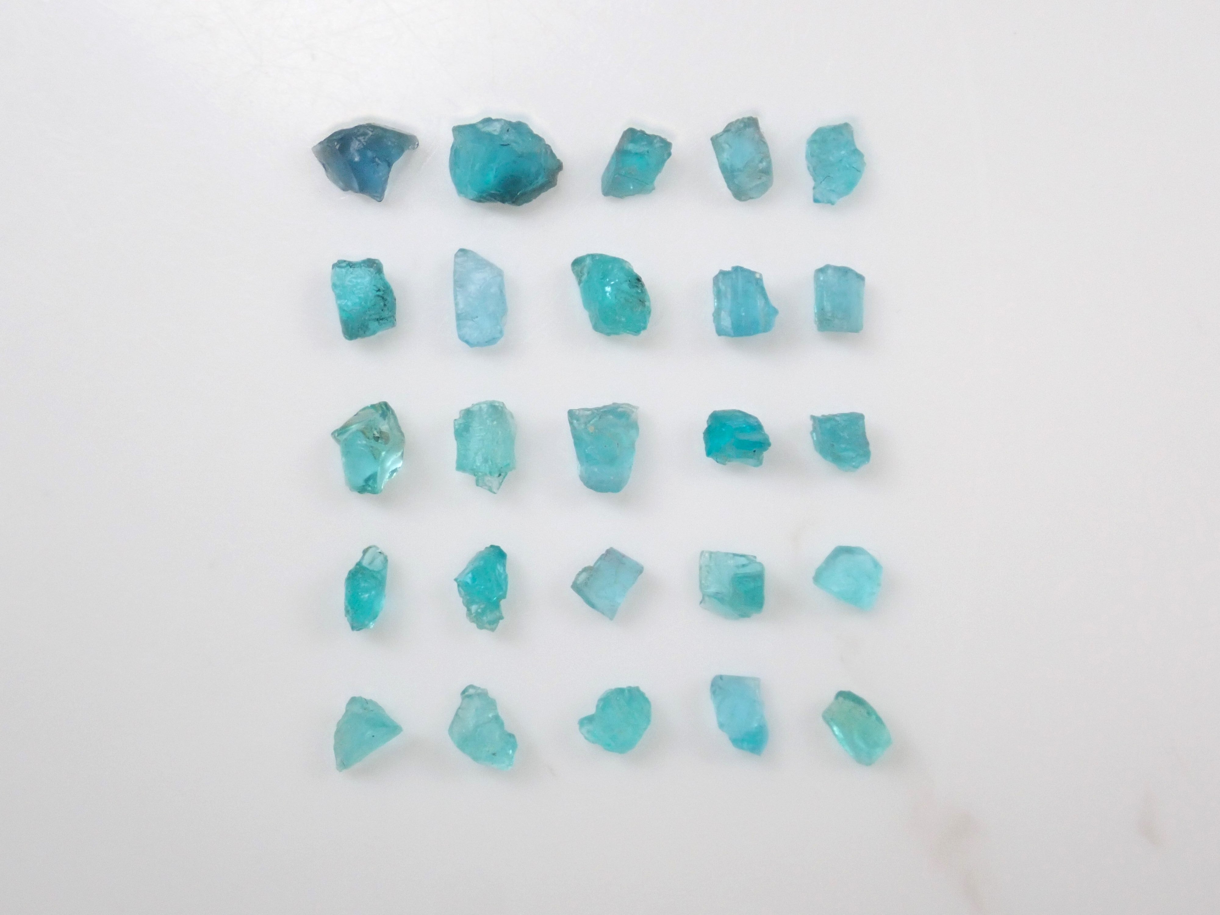 Limited to 25 stones: Brazilian Paraiba Tourmaline (including bicolor, Batalha) rough stones, average size 0.1ct. Discounts for multiple purchases available.