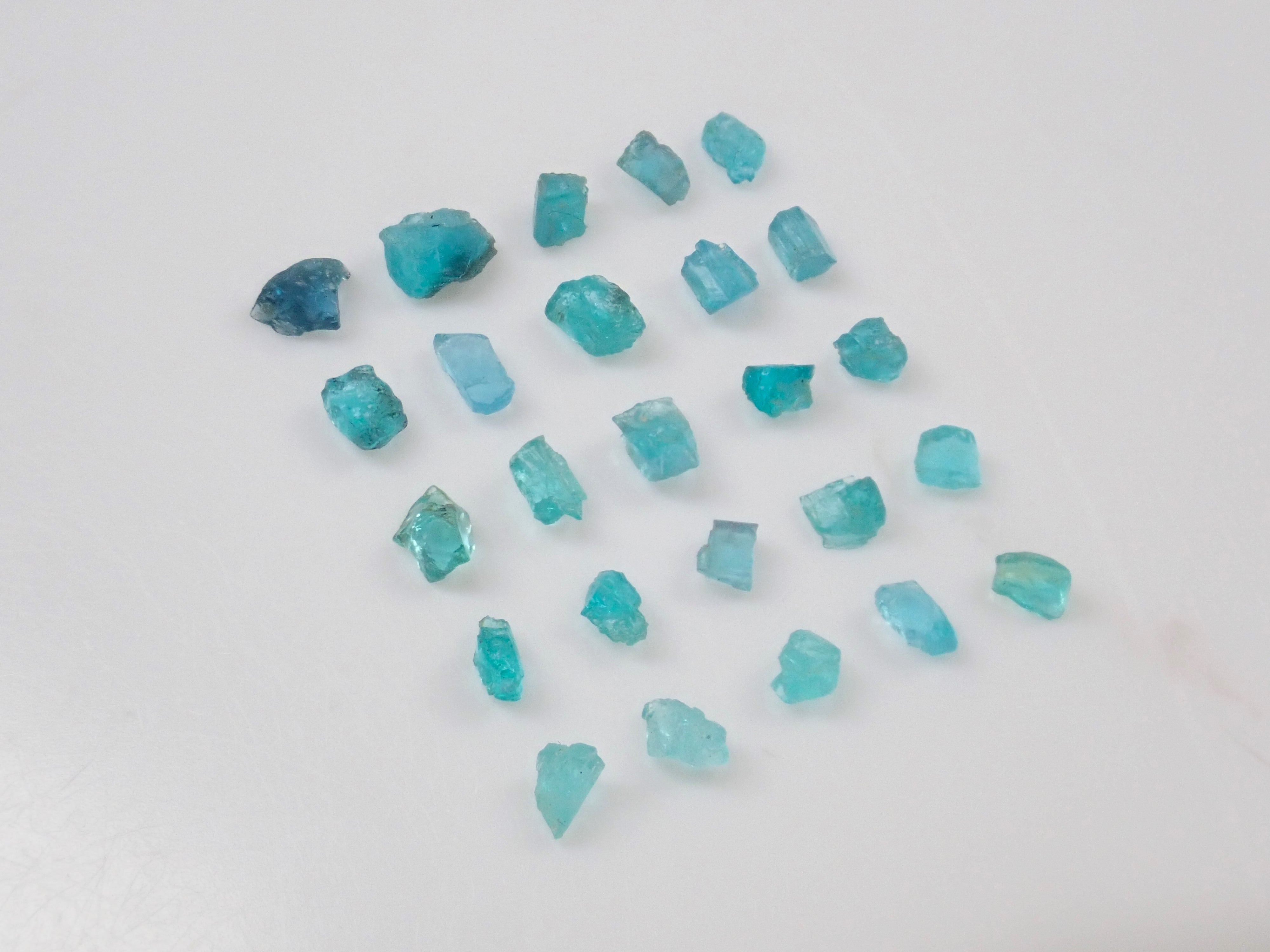 Limited to 25 stones: Brazilian Paraiba Tourmaline (including bicolor, Batalha) rough stones, average size 0.1ct. Discounts for multiple purchases available.