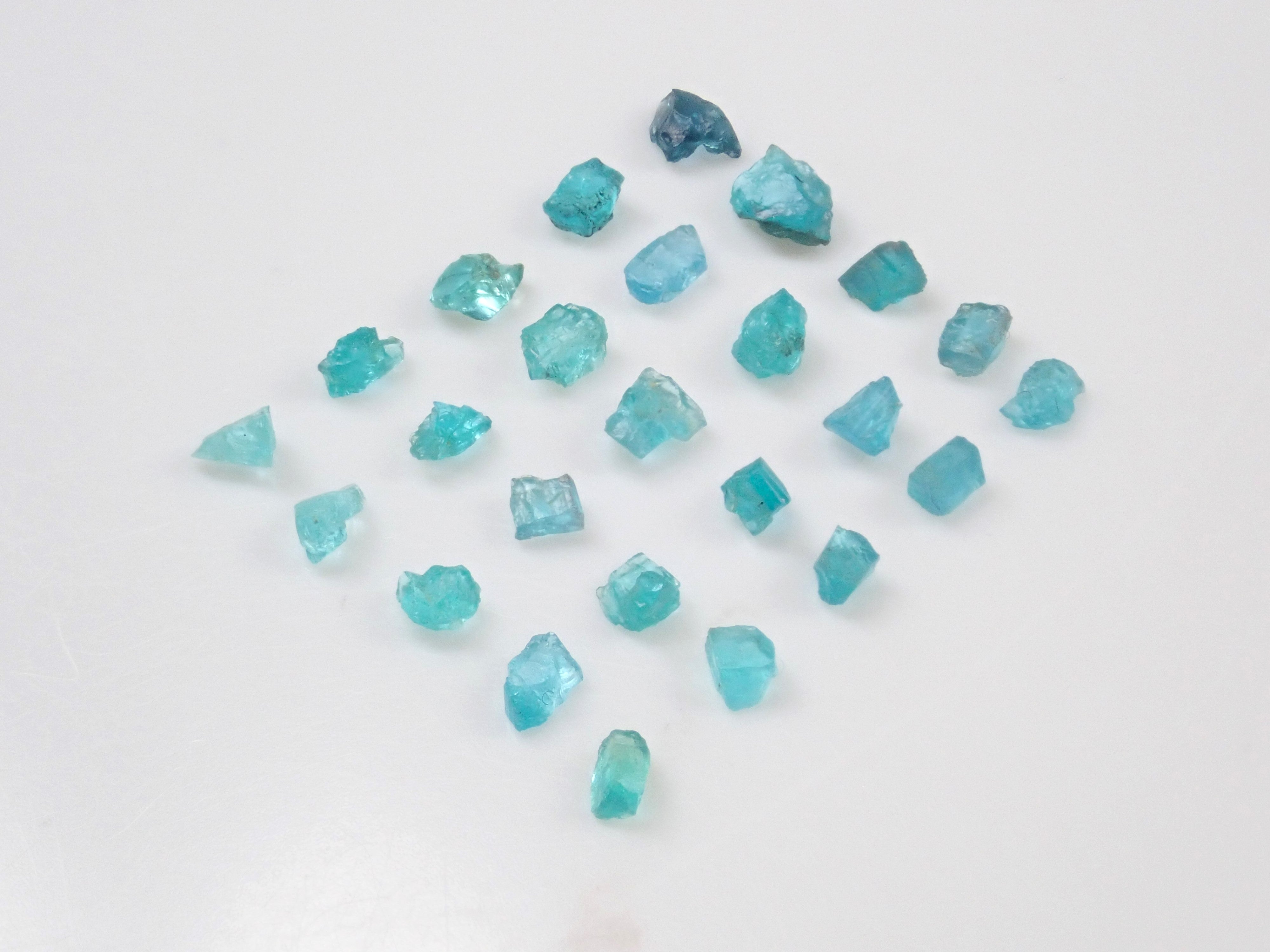 Limited to 25 stones: Brazilian Paraiba Tourmaline (including bicolor, Batalha) rough stones, average size 0.1ct. Discounts for multiple purchases available.