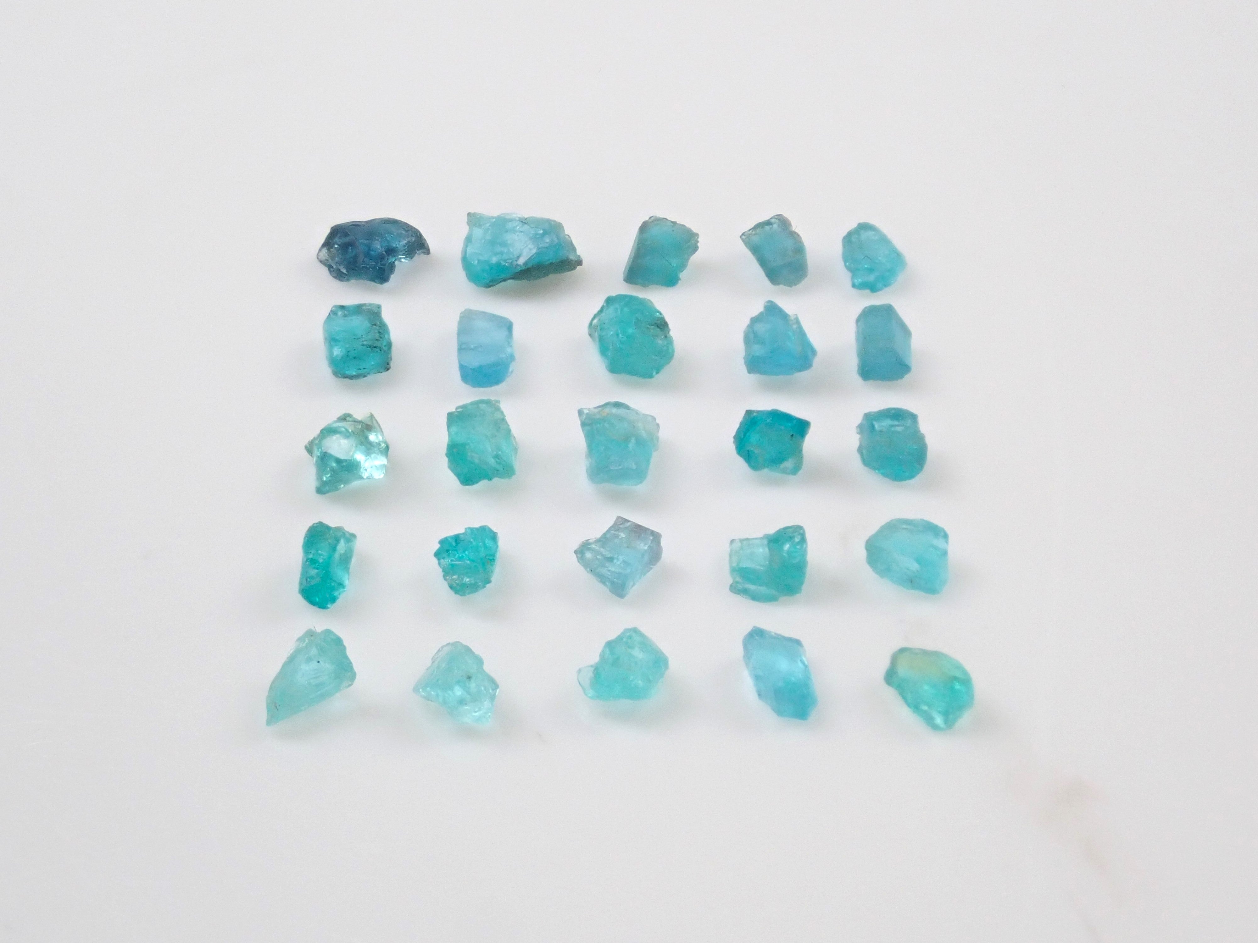 Limited to 25 stones: Brazilian Paraiba Tourmaline (including bicolor, Batalha) rough stones, average size 0.1ct. Discounts for multiple purchases available.