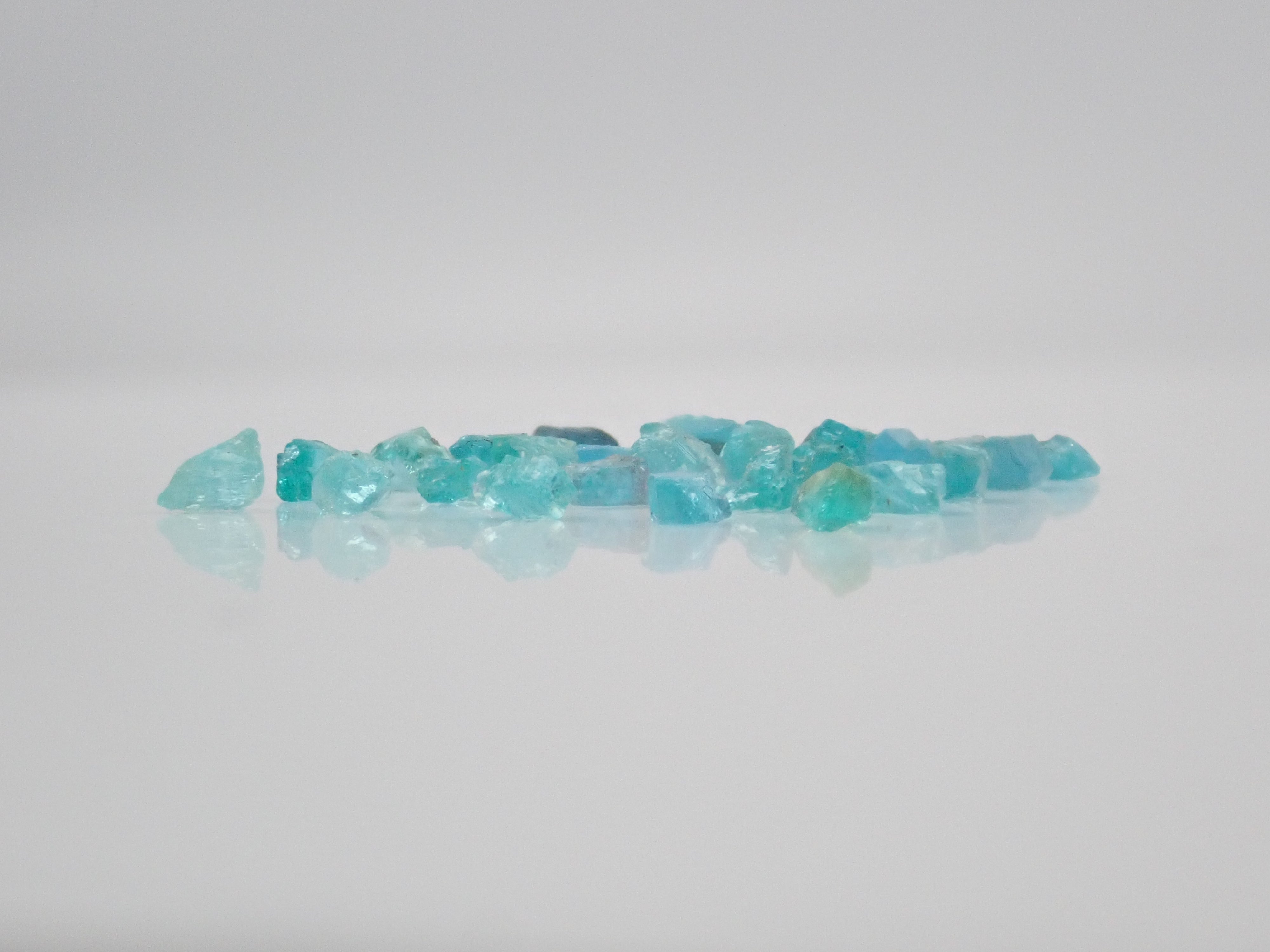 Limited to 25 stones: Brazilian Paraiba Tourmaline (including bicolor, Batalha) rough stones, average size 0.1ct. Discounts for multiple purchases available.