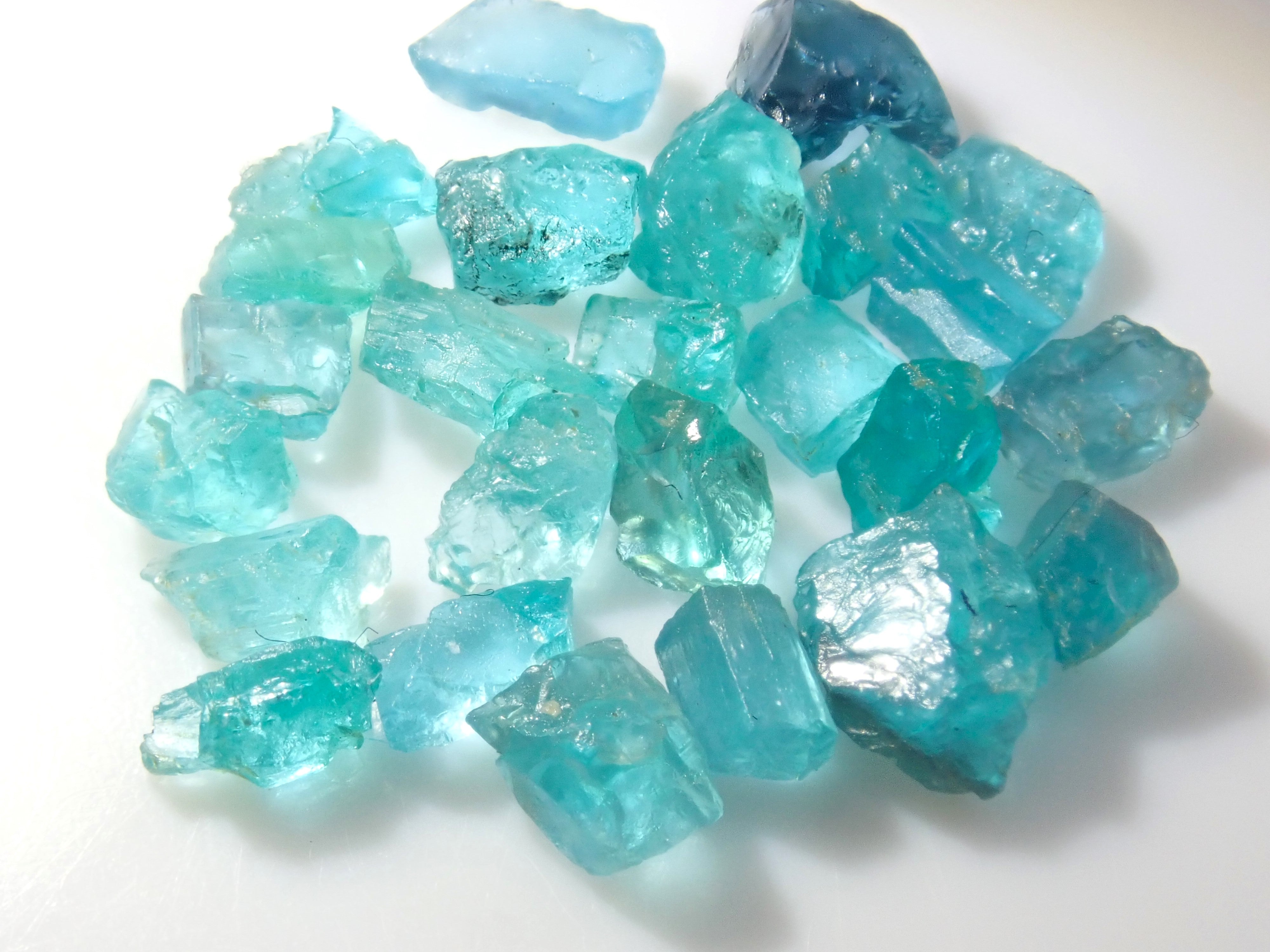 Limited to 25 stones: Brazilian Paraiba Tourmaline (including bicolor, Batalha) rough stones, average size 0.1ct. Discounts for multiple purchases available.