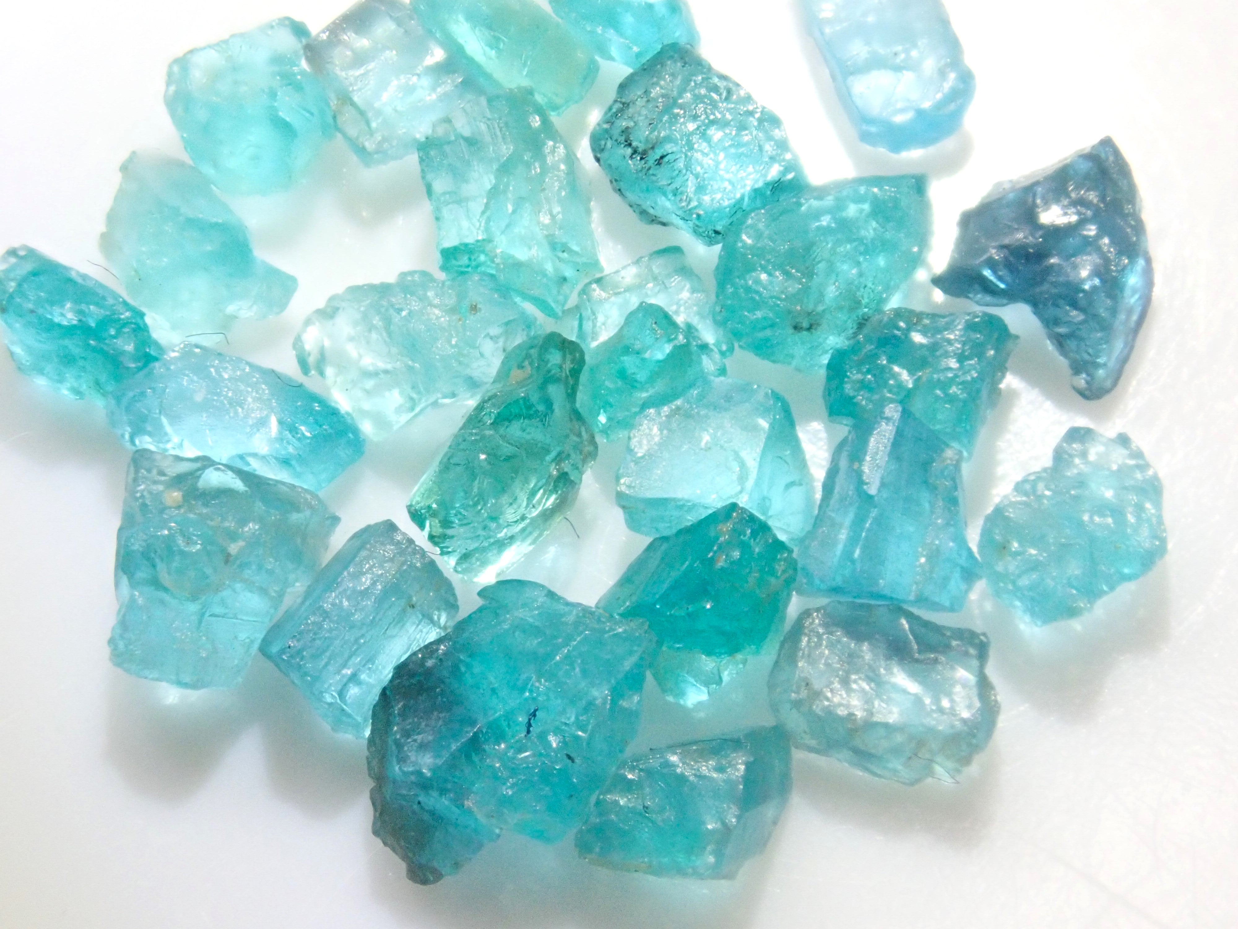 Limited to 25 stones: Brazilian Paraiba Tourmaline (including bicolor, Batalha) rough stones, average size 0.1ct. Discounts for multiple purchases available.