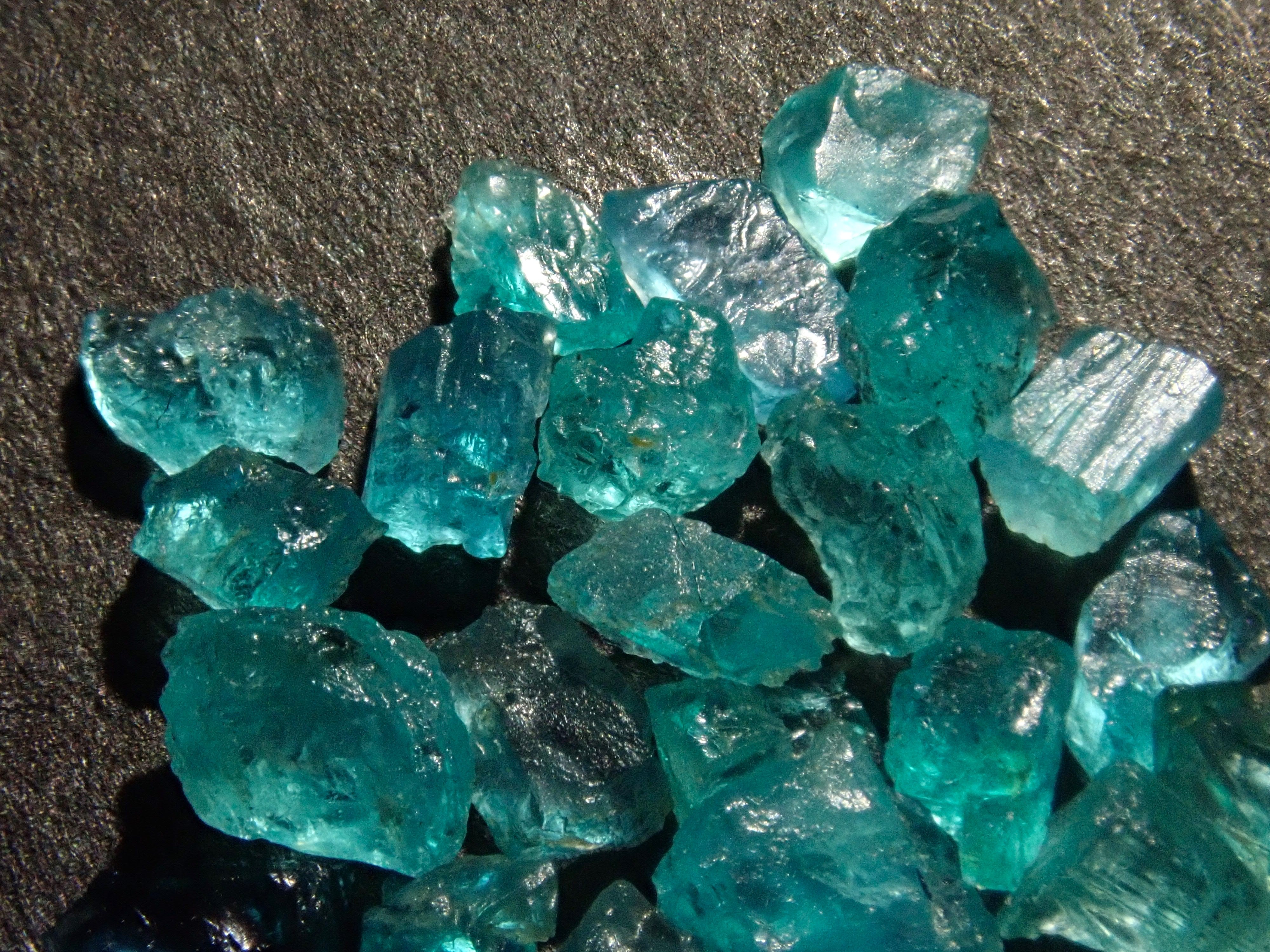 Limited to 25 stones: Brazilian Paraiba Tourmaline (including bicolor, Batalha) rough stones, average size 0.1ct. Discounts for multiple purchases available.