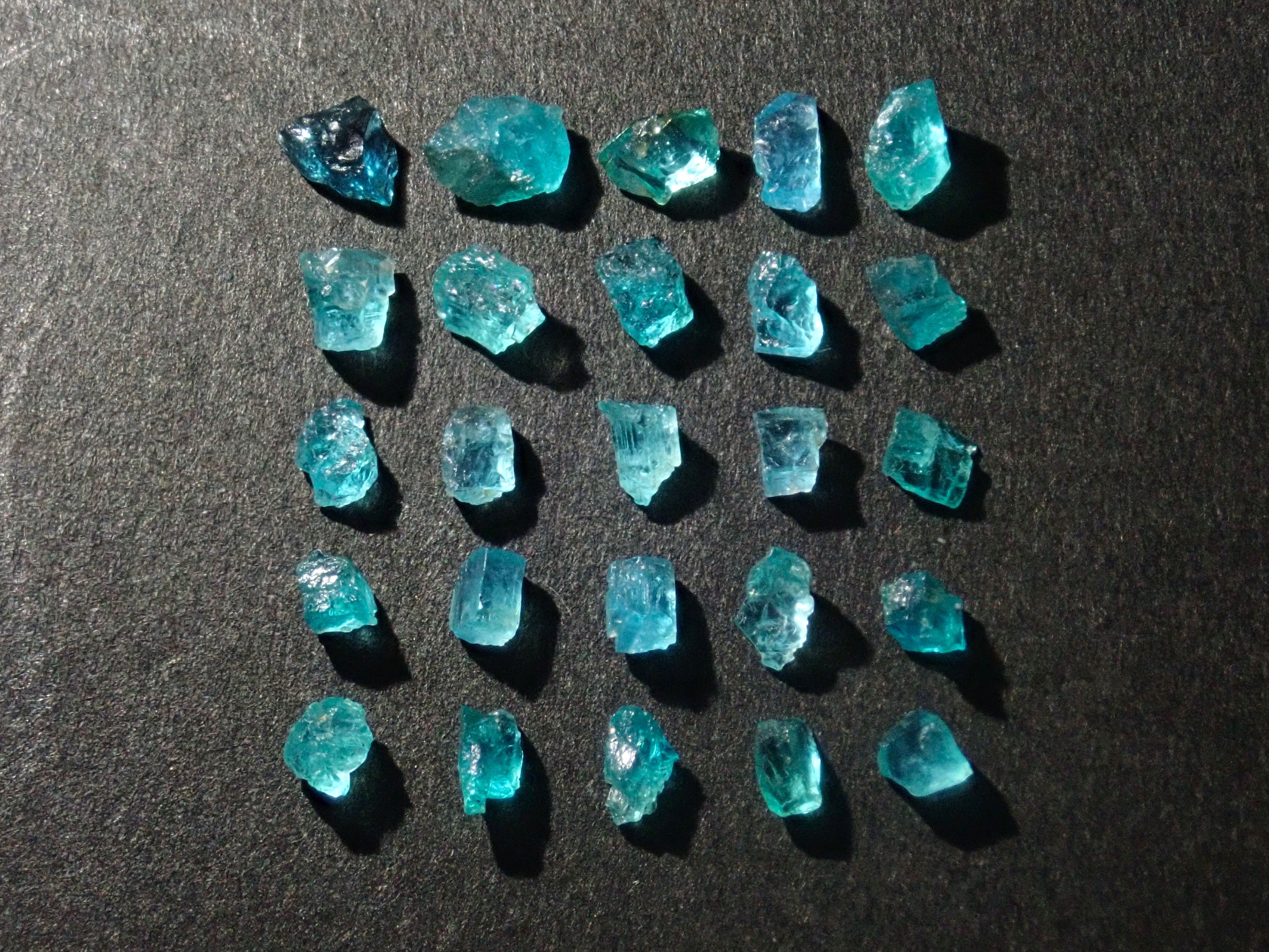 Limited to 25 stones: Brazilian Paraiba Tourmaline (including bicolor, Batalha) rough stones, average size 0.1ct. Discounts for multiple purchases available.