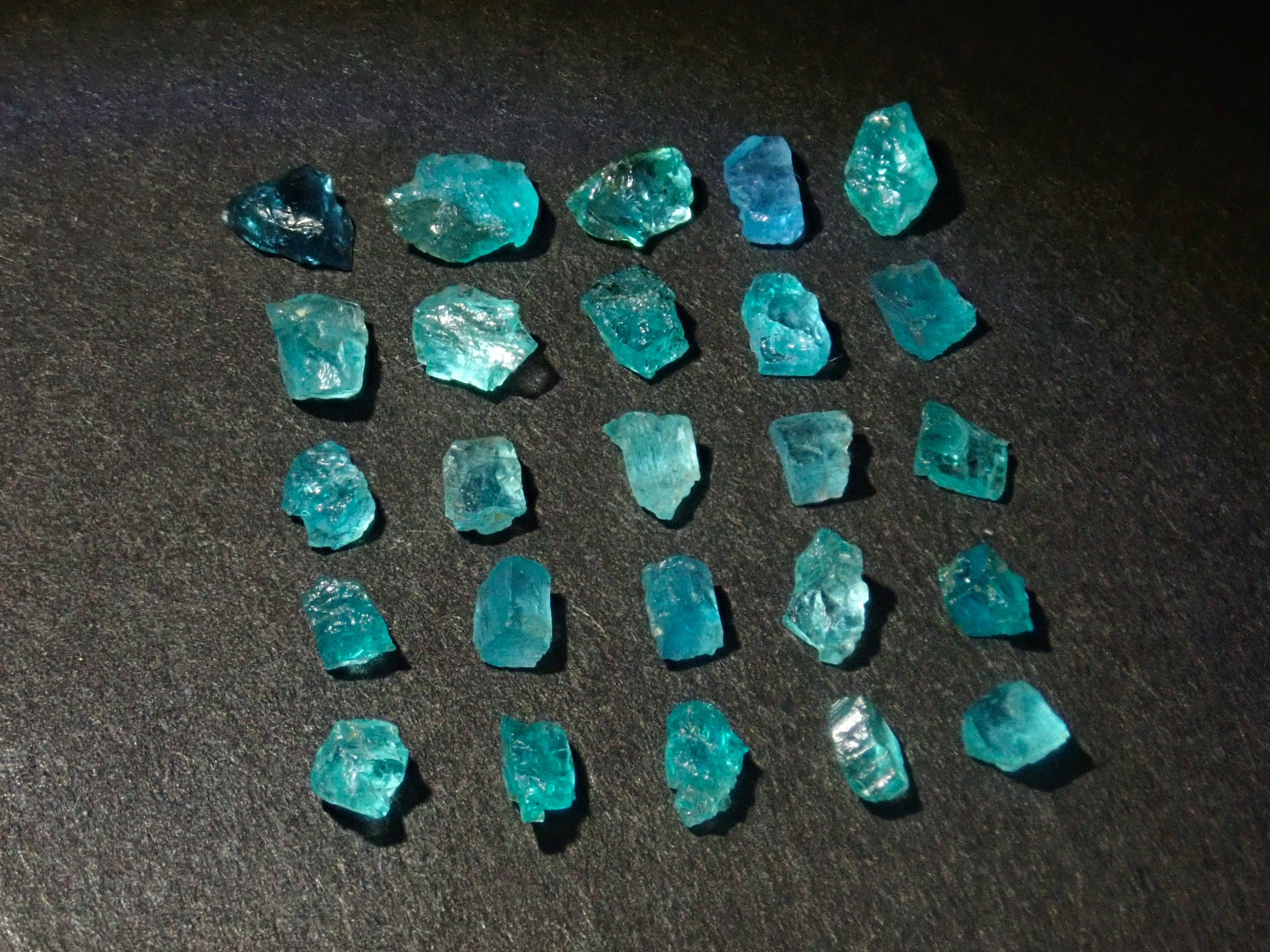 Limited to 25 stones: Brazilian Paraiba Tourmaline (including bicolor, Batalha) rough stones, average size 0.1ct. Discounts for multiple purchases available.