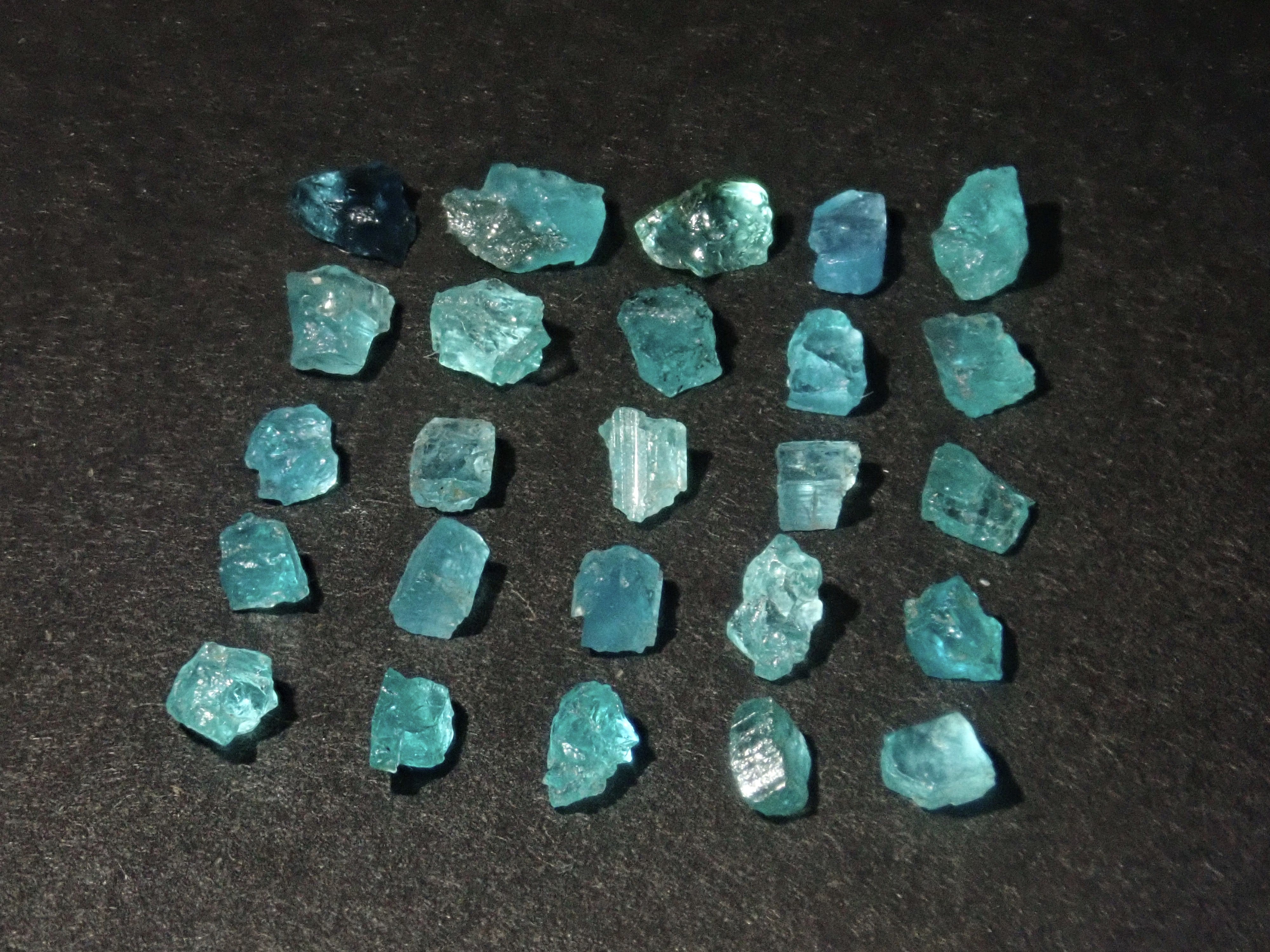 Limited to 25 stones: Brazilian Paraiba Tourmaline (including bicolor, Batalha) rough stones, average size 0.1ct. Discounts for multiple purchases available.