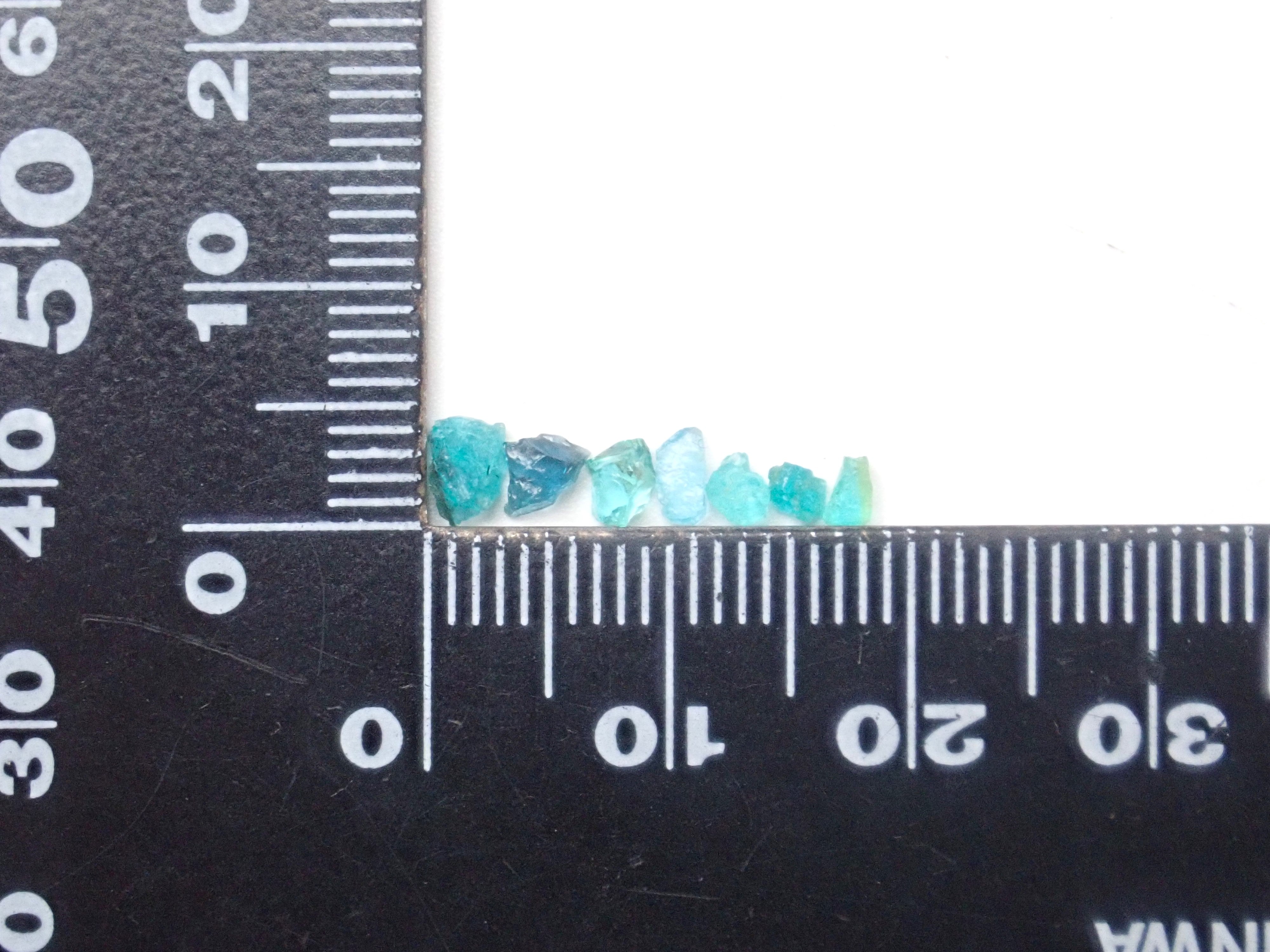 Limited to 25 stones: Brazilian Paraiba Tourmaline (including bicolor, Batalha) rough stones, average size 0.1ct. Discounts for multiple purchases available.