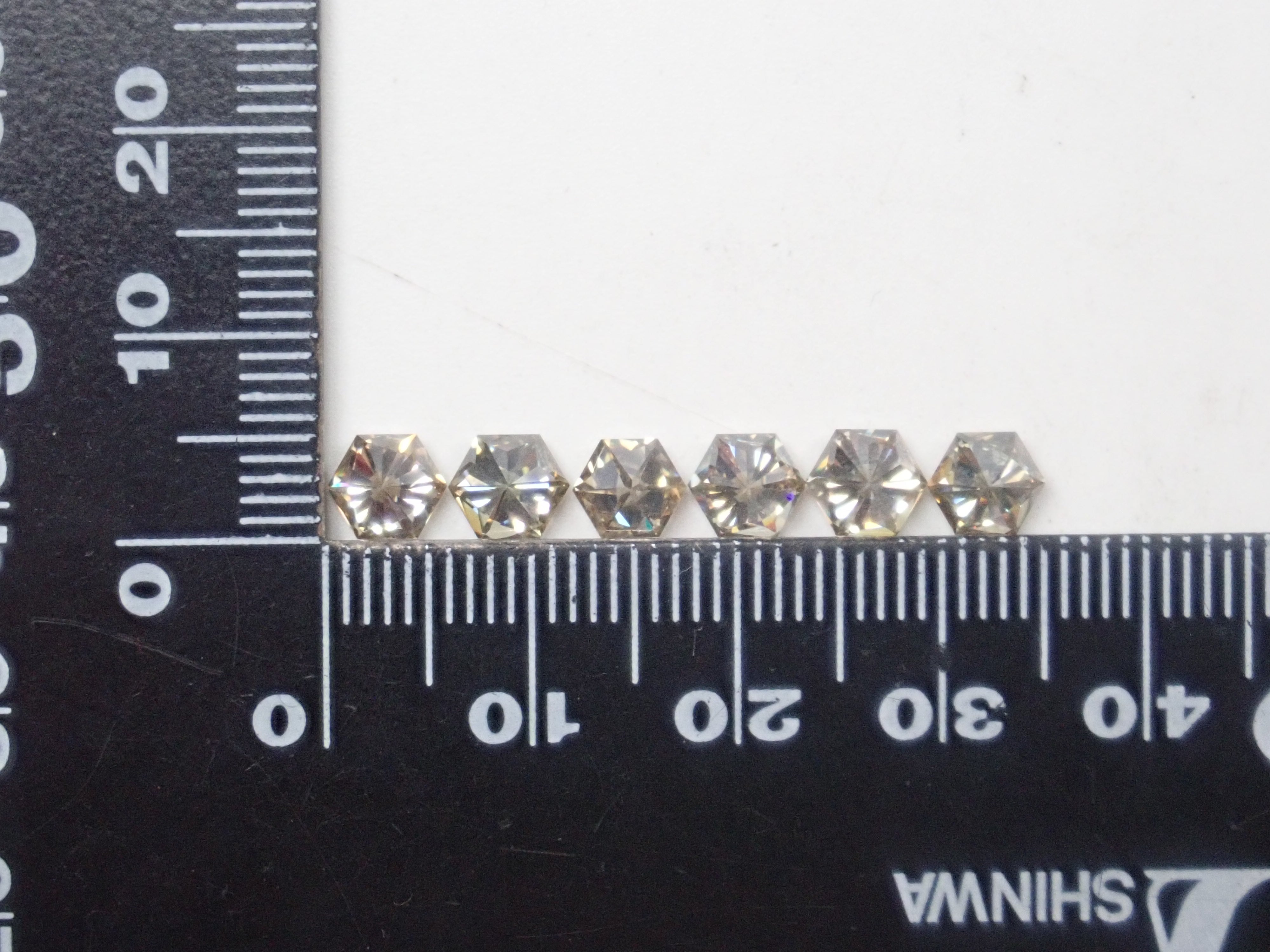 Limited to 6 stones: 1 synthetic moissanite loose stone (hexagonal cut, 5mm) Multiple purchase discounts available