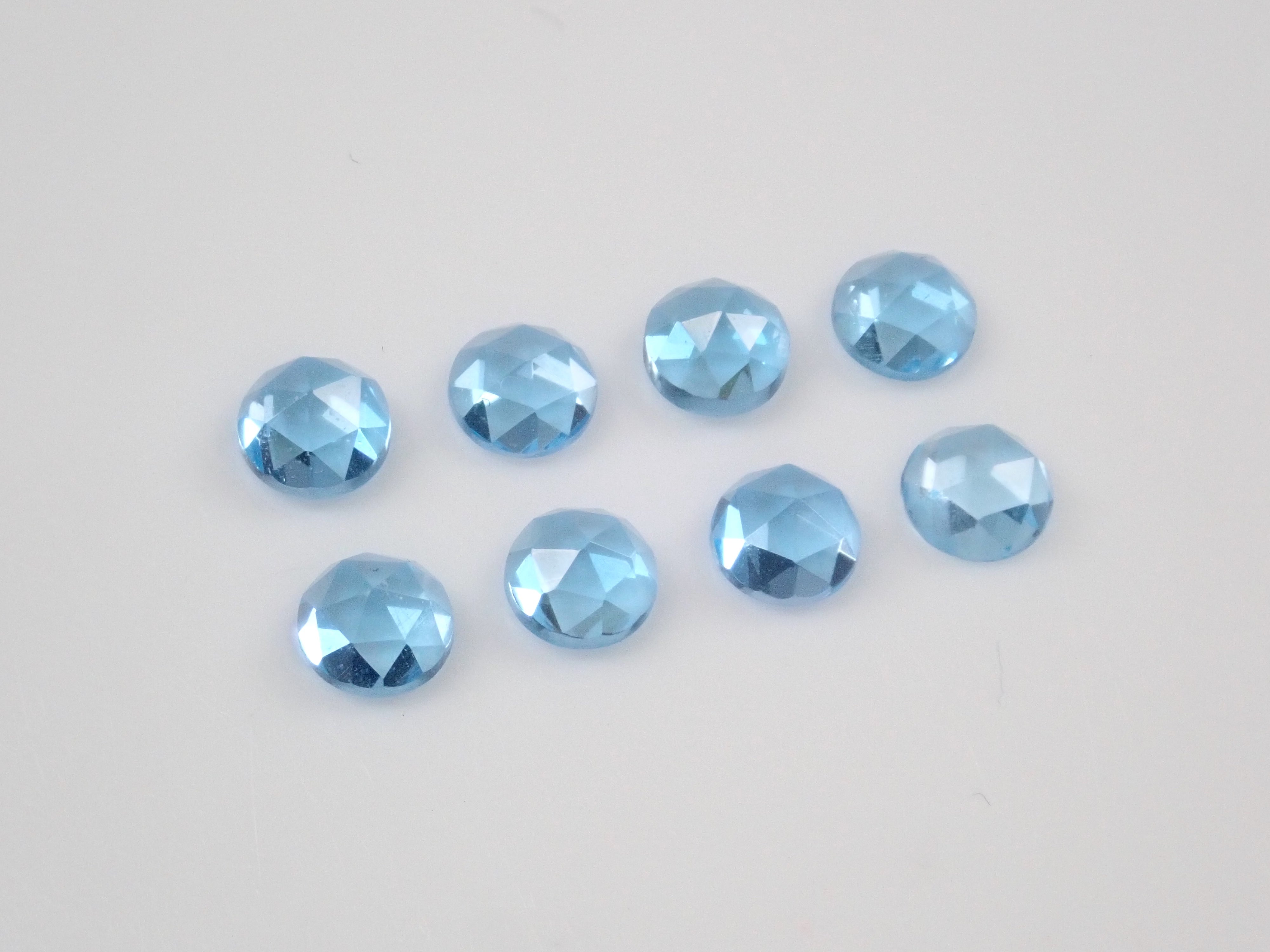 Limited to 8 stones: Swiss blue topaz (4mm, rose cut) 1 loose stone. Discounts available for multiple purchases.