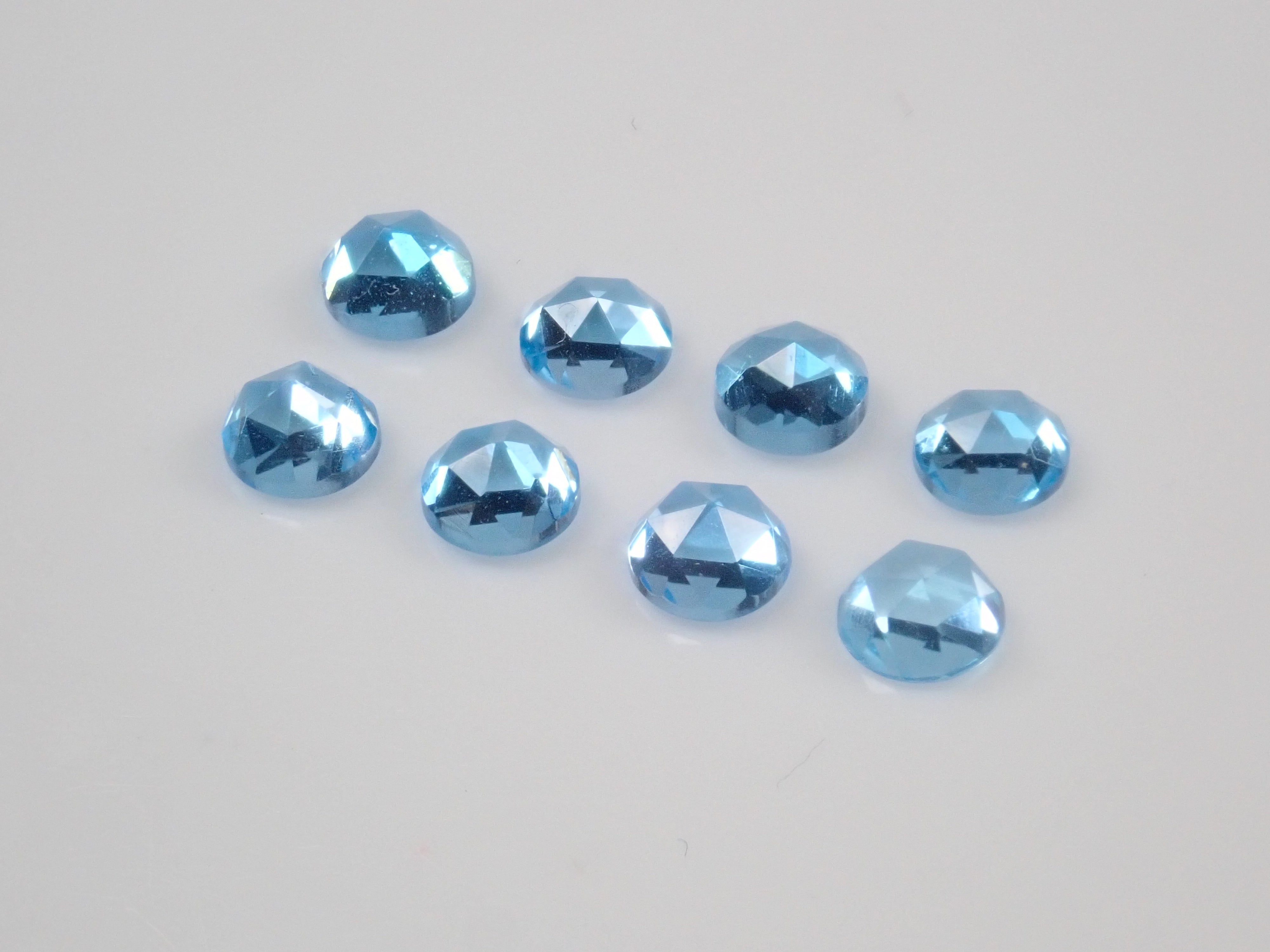 Limited to 8 stones: Swiss blue topaz (4mm, rose cut) 1 loose stone. Discounts available for multiple purchases.