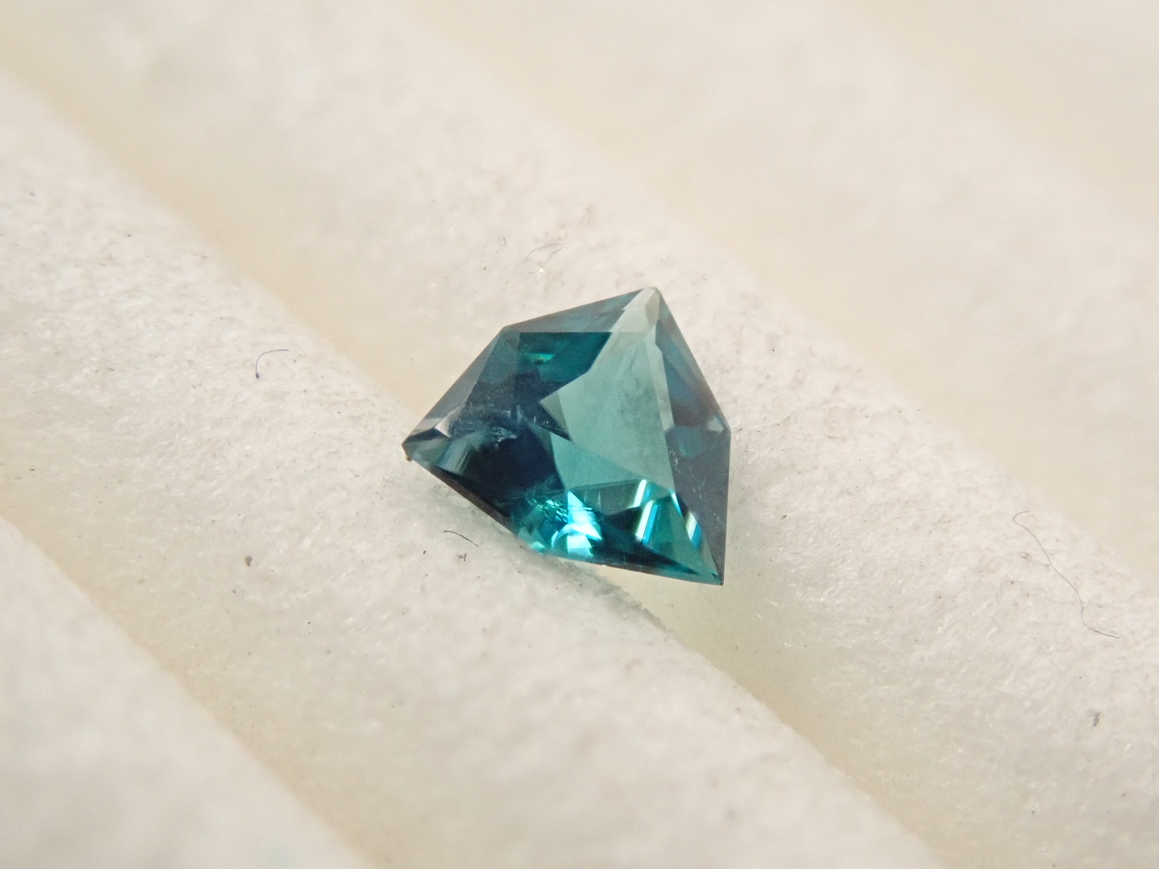 [12561267] Grandidierite from Madagascar 0.097ct loose stone