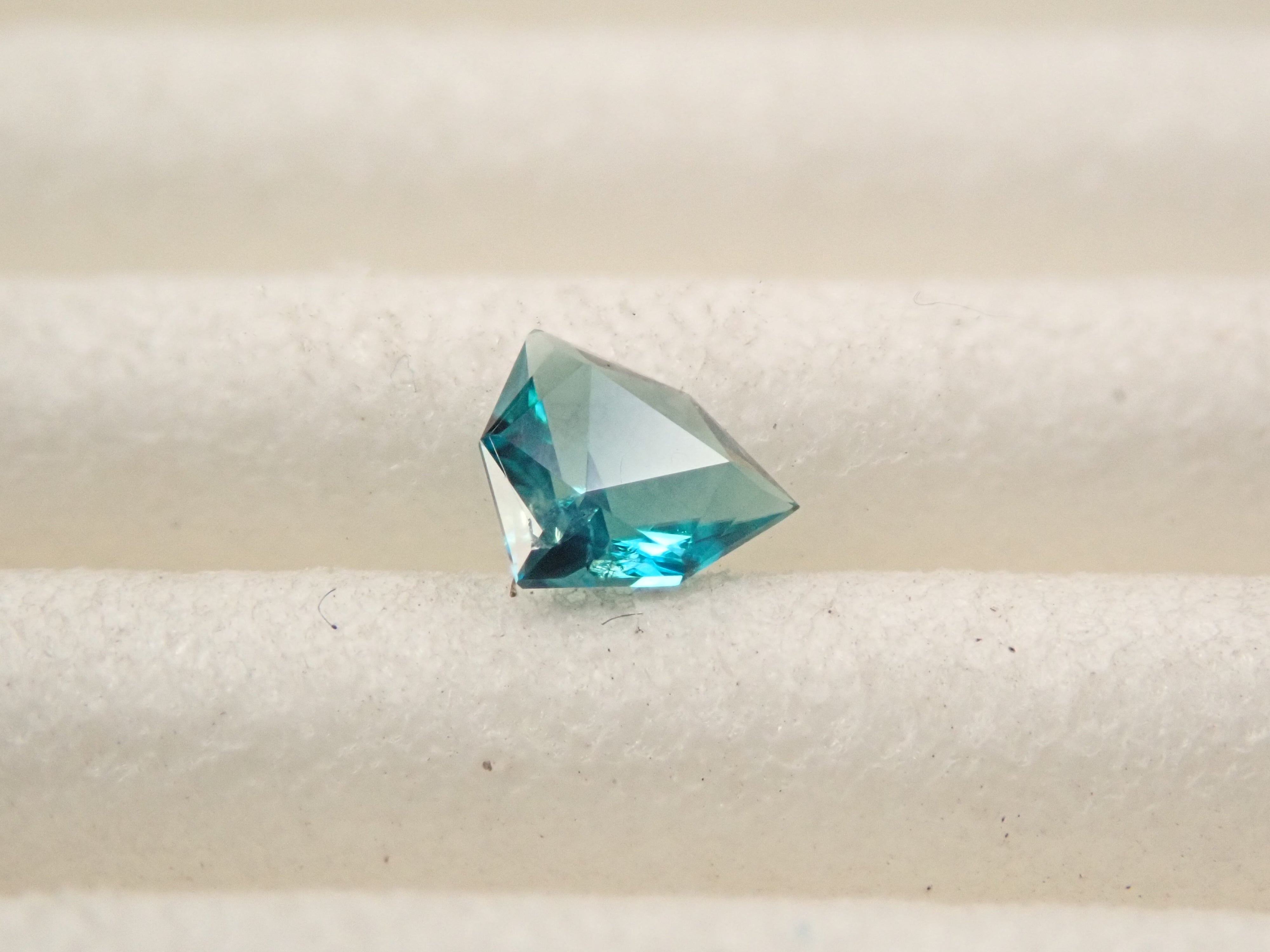 [12561267] Grandidierite from Madagascar 0.097ct loose stone
