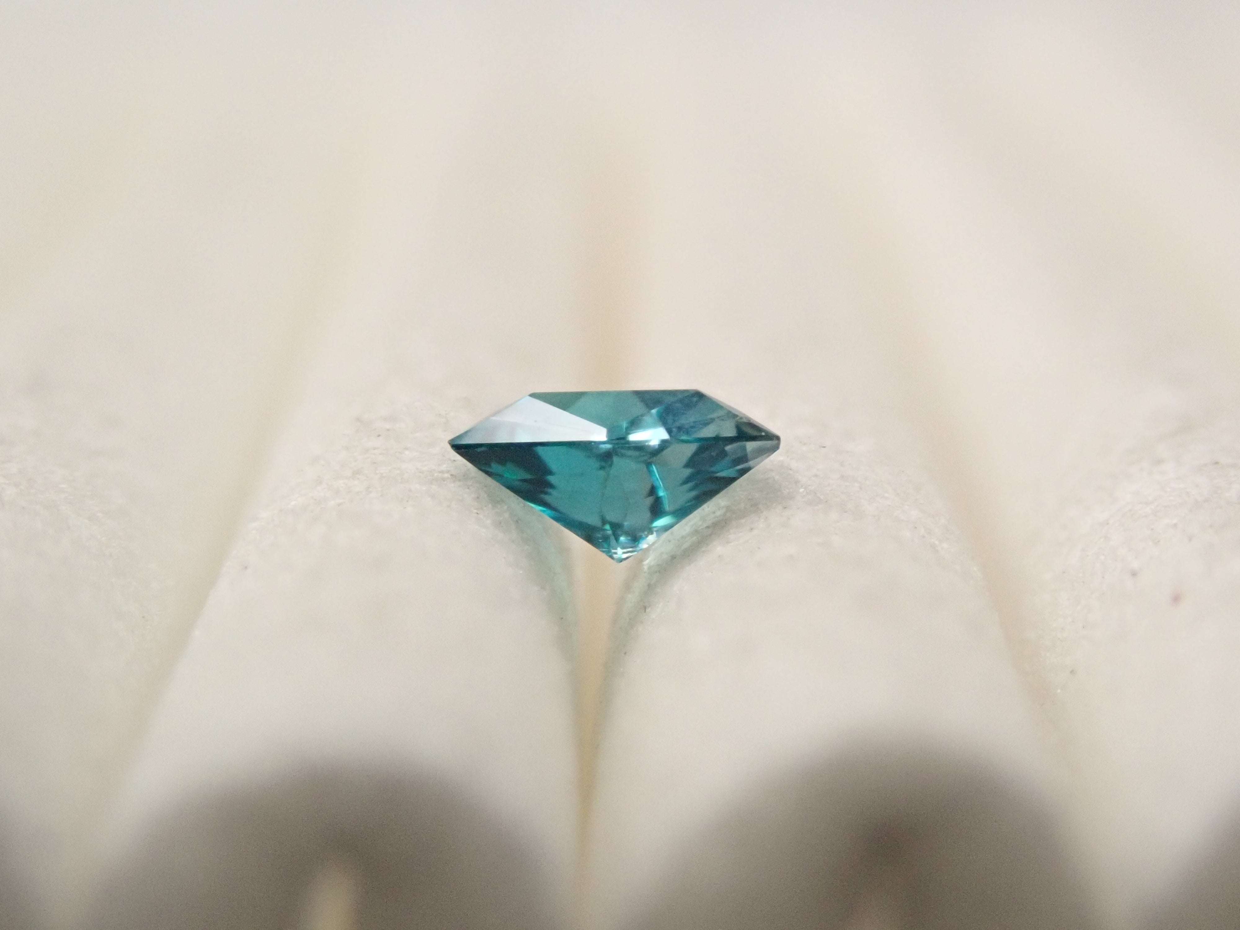 [12561267] Grandidierite from Madagascar 0.097ct loose stone