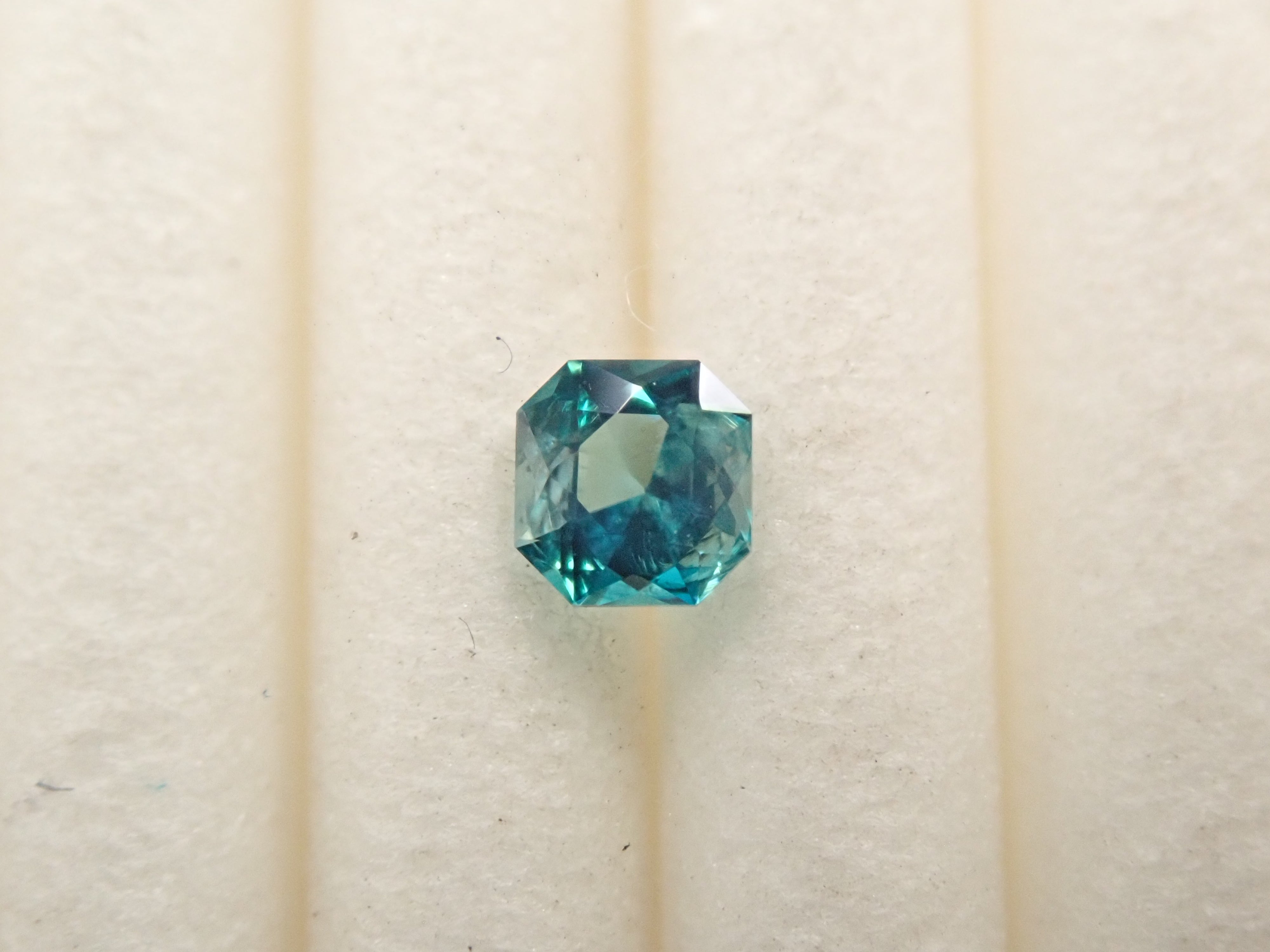 [12561268] Grandidierite from Madagascar 0.099ct loose stone