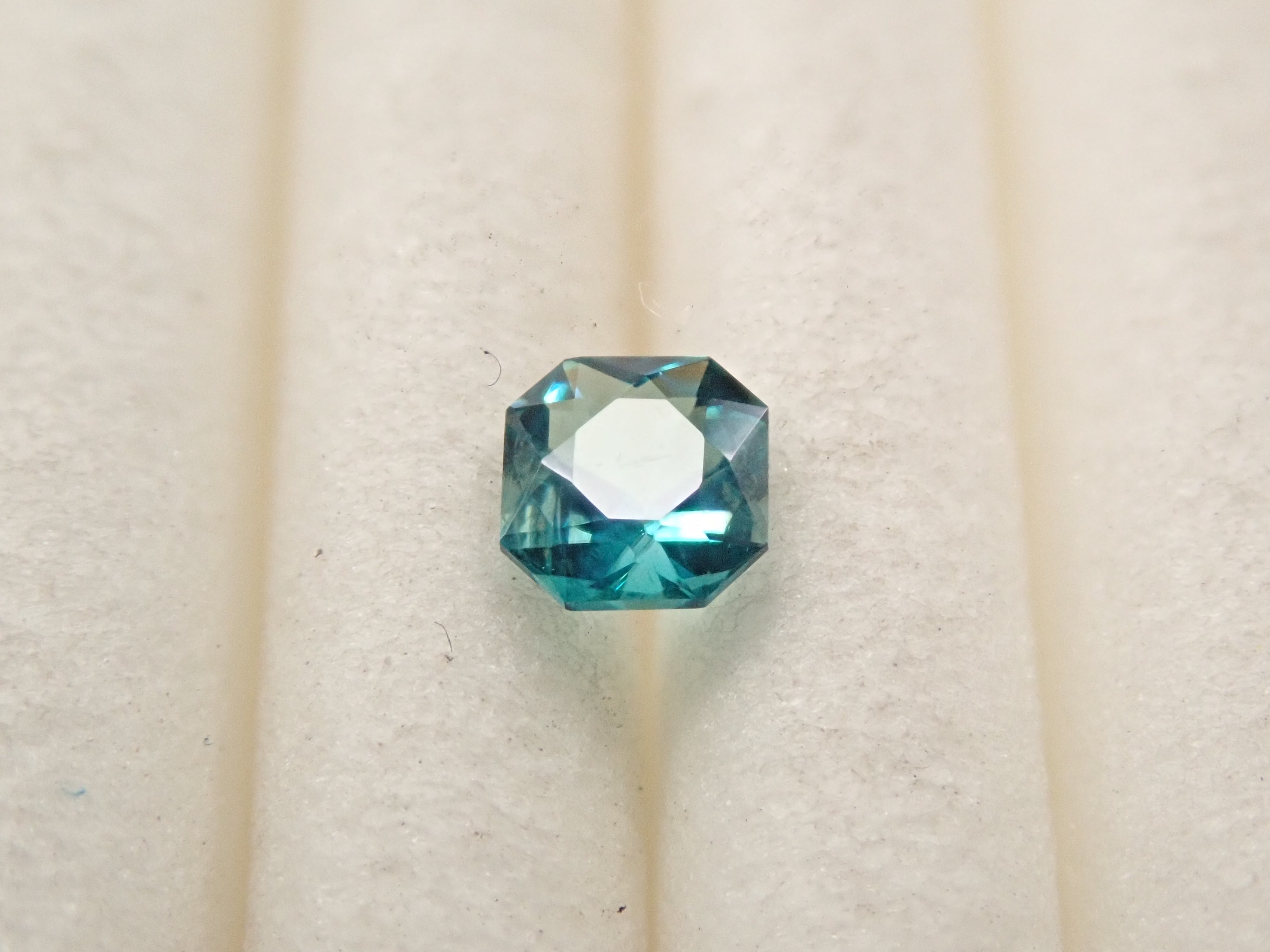[12561268] Grandidierite from Madagascar 0.099ct loose stone