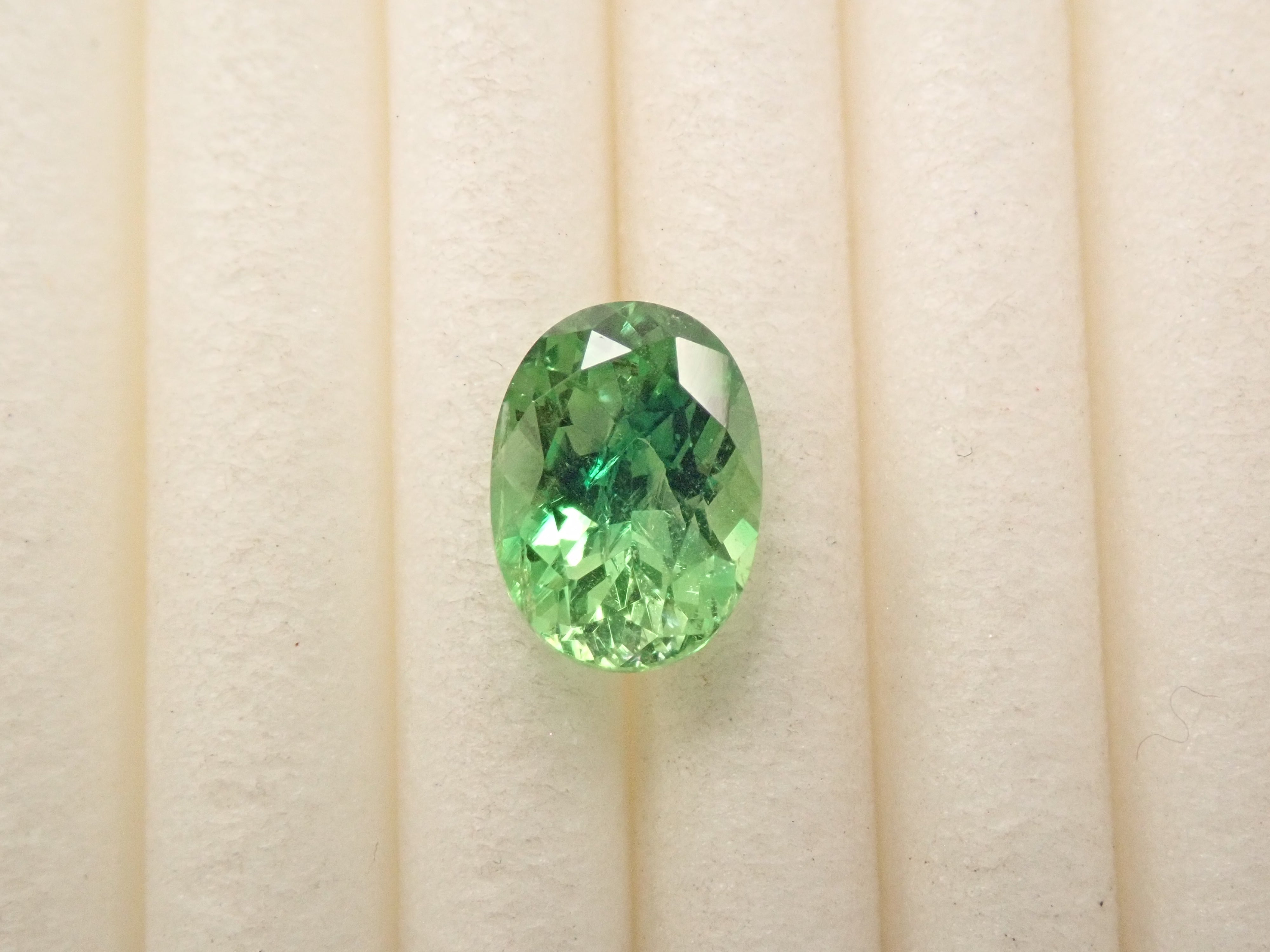 【12561607掲載】タンザニア産バイカラーグロッシュラーガーネット 0.796ctルース