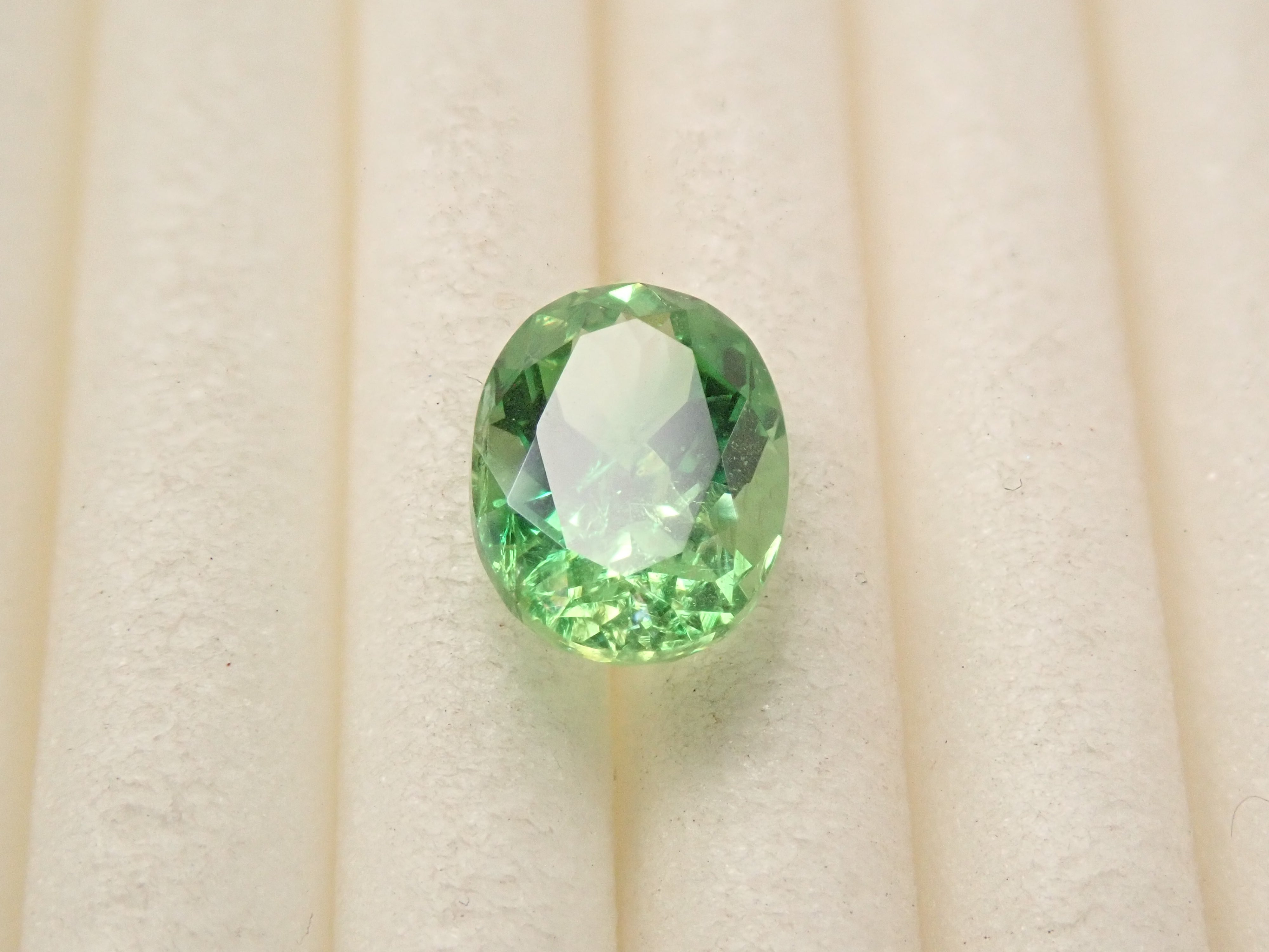 【12561607掲載】タンザニア産バイカラーグロッシュラーガーネット 0.796ctルース