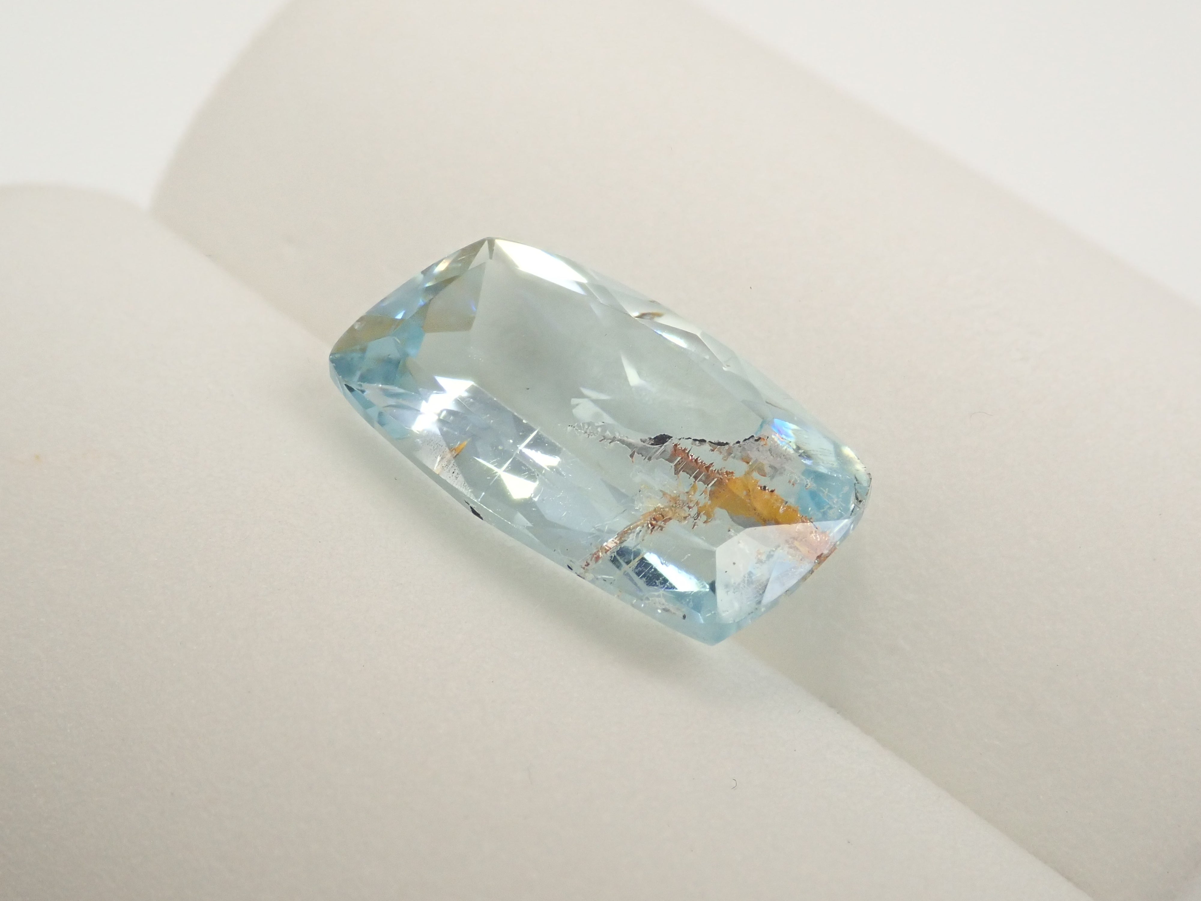 【12562025掲載】ブラジル産ライモナイトインブルートパーズ 6.701ctルース