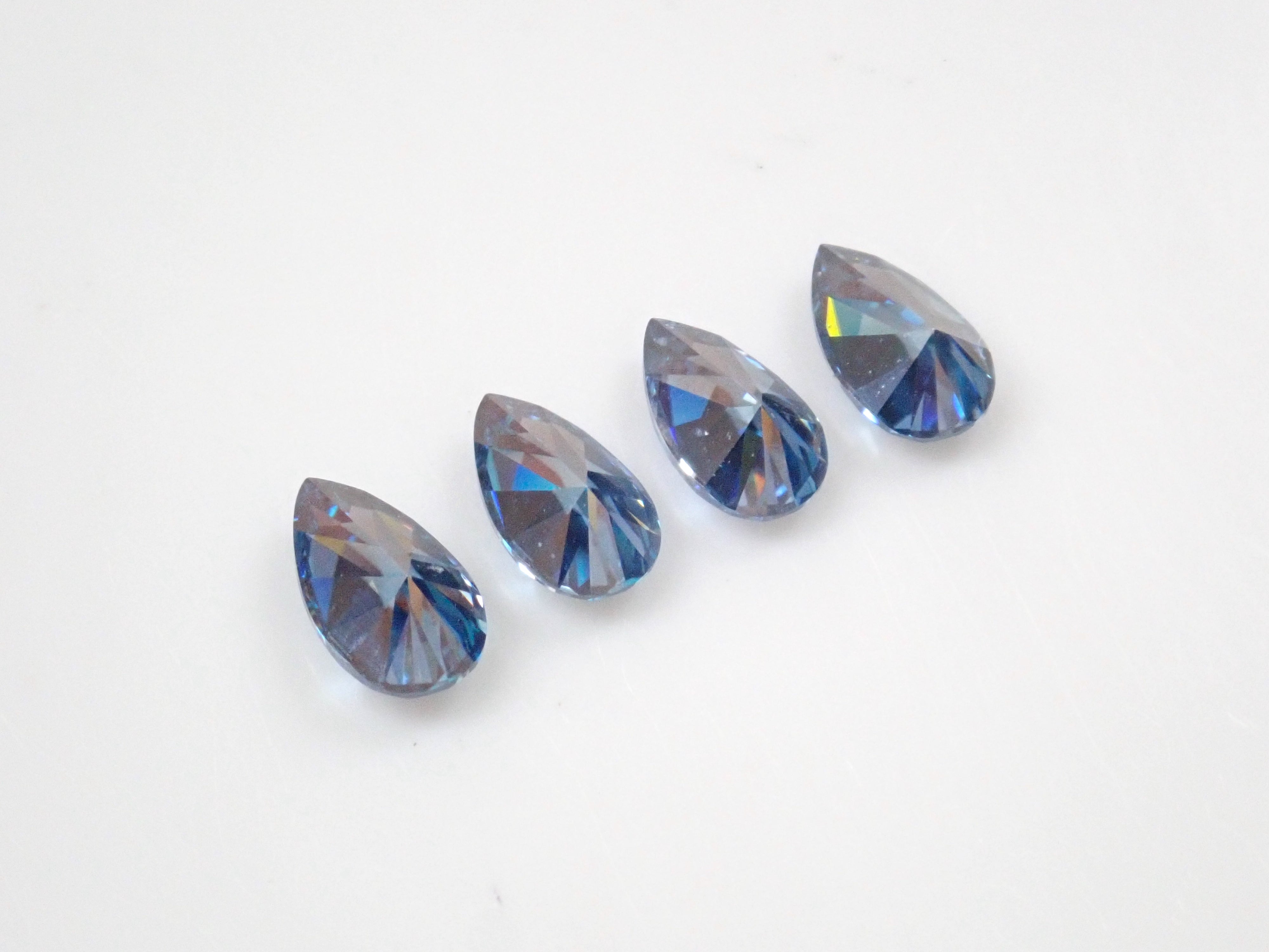 Limited to 4 stones: 1 synthetic moissanite loose stone (blue moissanite, pear shape, 3 x 5 mm) Multiple purchase discounts available