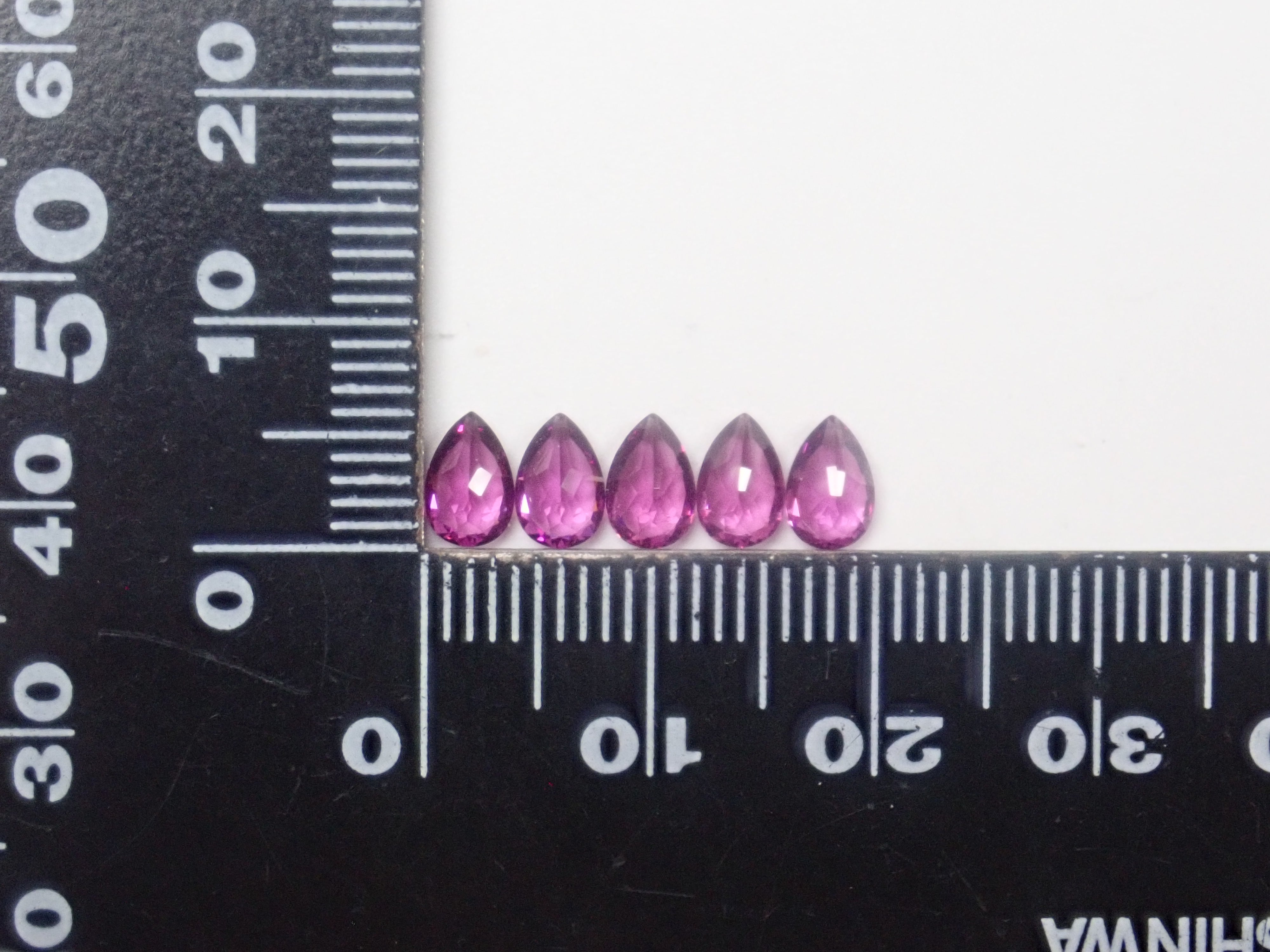 モザンビーク産グレープガーネット1石ルース（6×4mm,ペアシェイプ